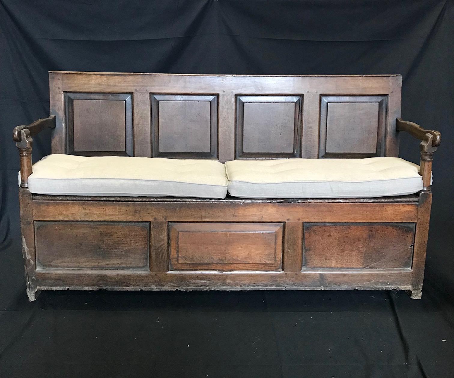 Incredible early British bench having richly carved back with panelled squares, handsome arms and a seat that lifts to reveal storage inside. Two new seat cushions are included.
Measures: Seat height 23
arm height 31
1780-1820.