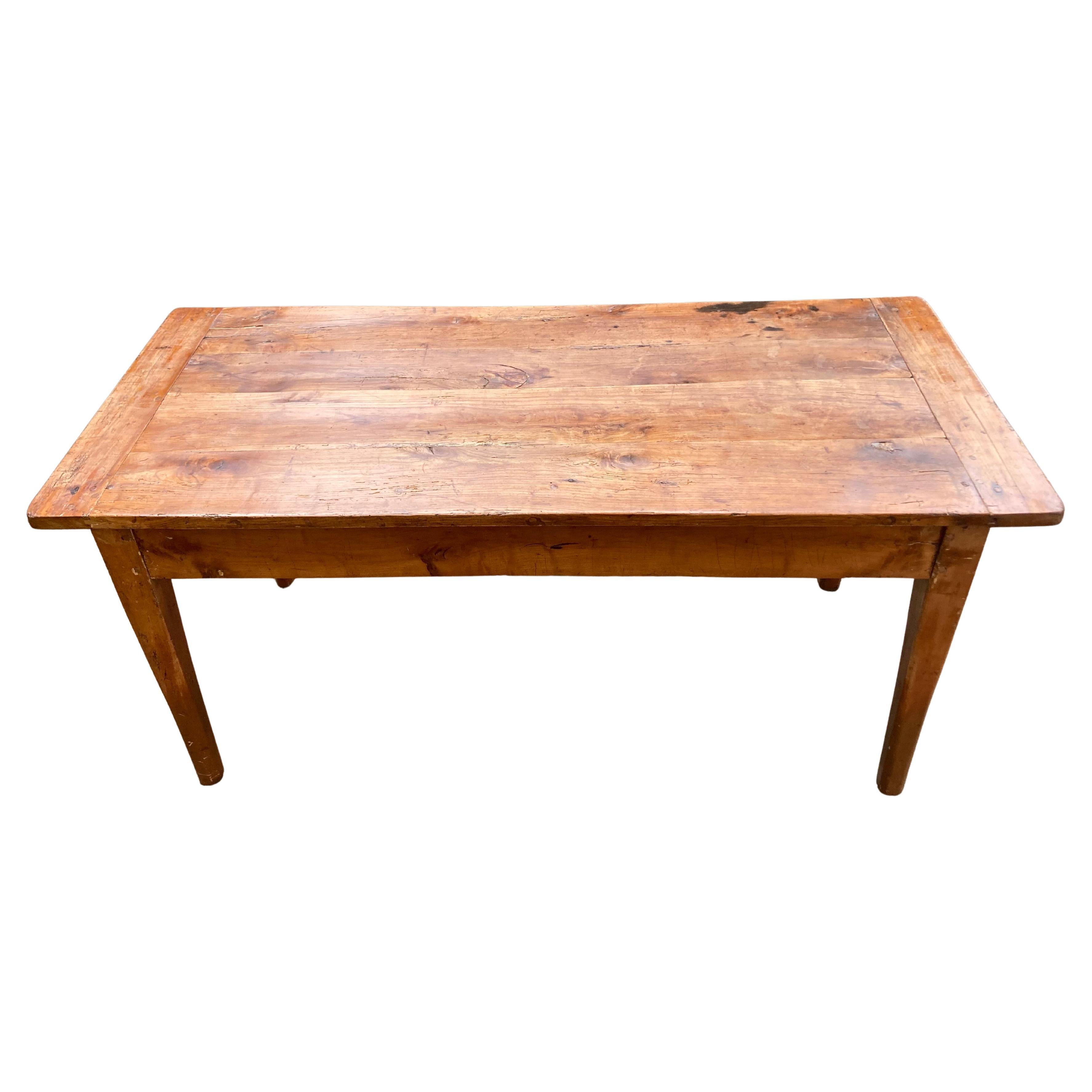 Wonderful hard to find weathered heavy French oak farm table having tapered legs and two drawers at the ends, one working.  Left in natural aged condition.  MD
Apron height 24”
29” D x 31.25” H x 65.5” W