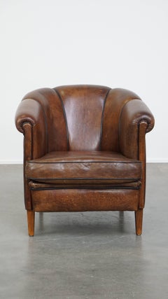 Characterful Dark Sheepskin Leather Club Chair with Black Piping