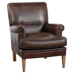 Characterful sheep leather armchair with a beautiful deep colour