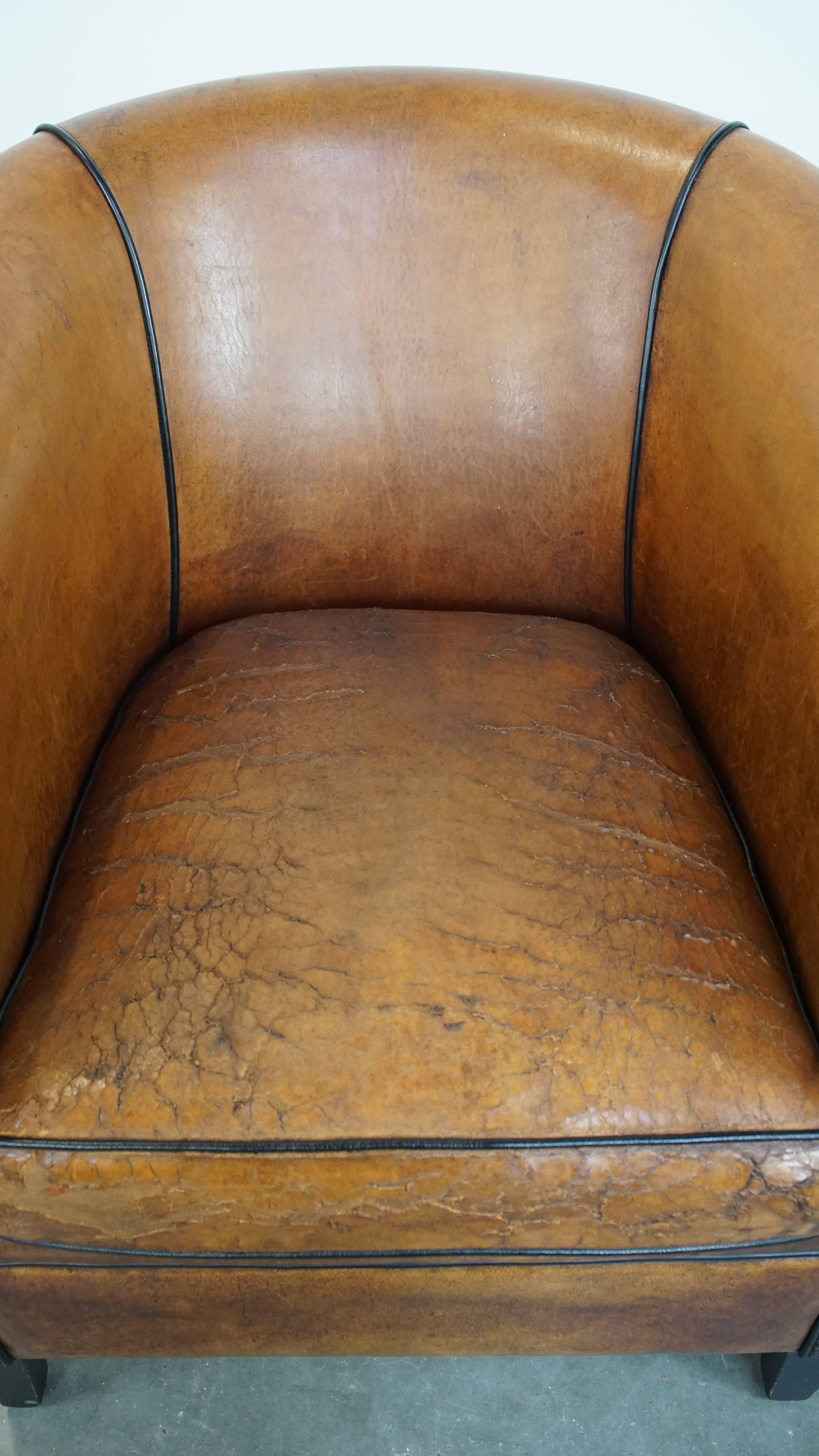 Sheepskin Characterful sheepskin club chair with a tough worn look and a beautiful patina For Sale