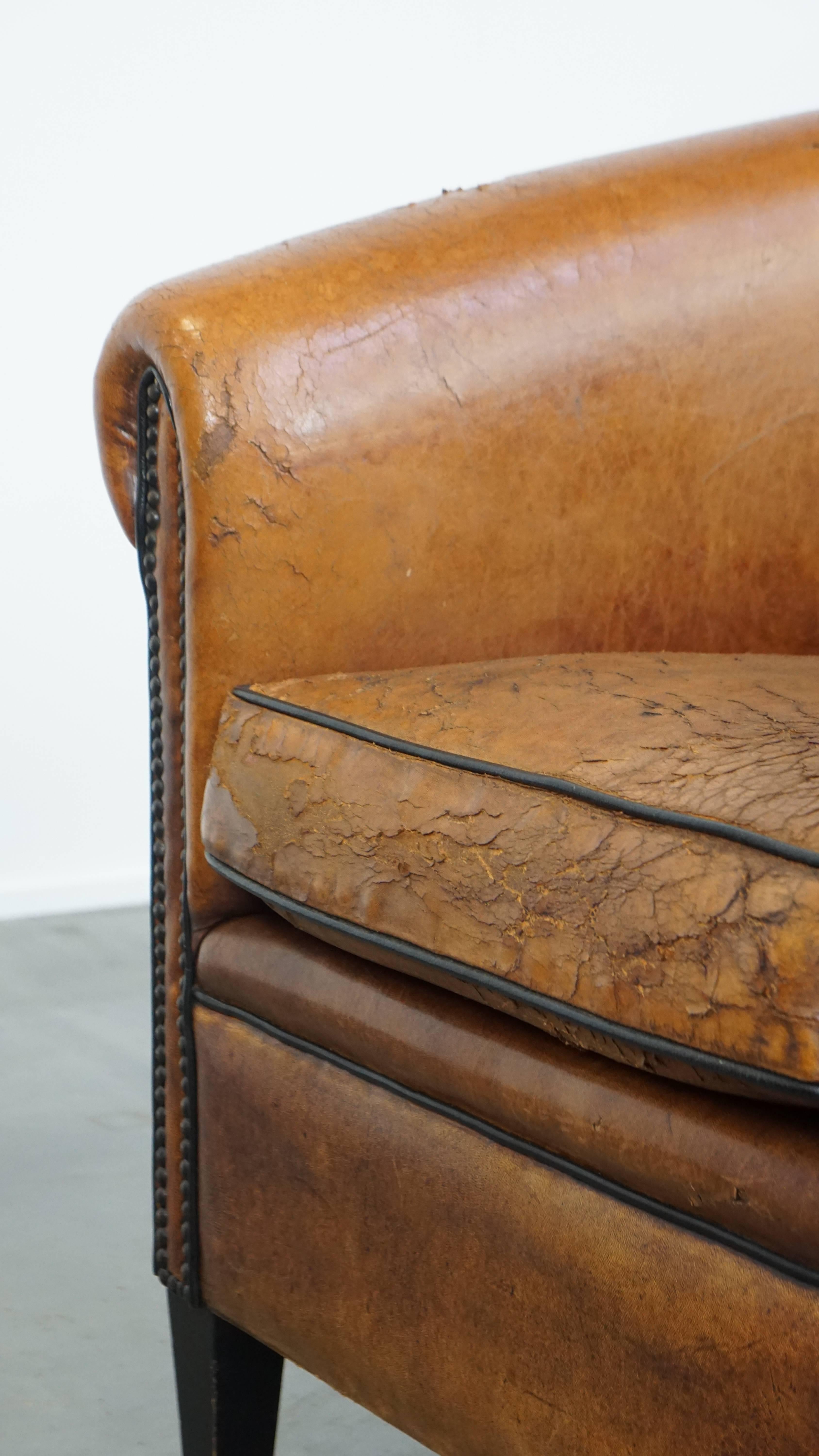 Characterful sheepskin club chair with a tough worn look and a beautiful patina For Sale 3