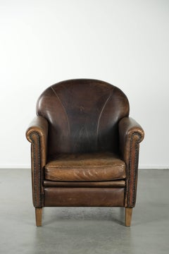 Characterful sheepskin design armchair with beautiful patina