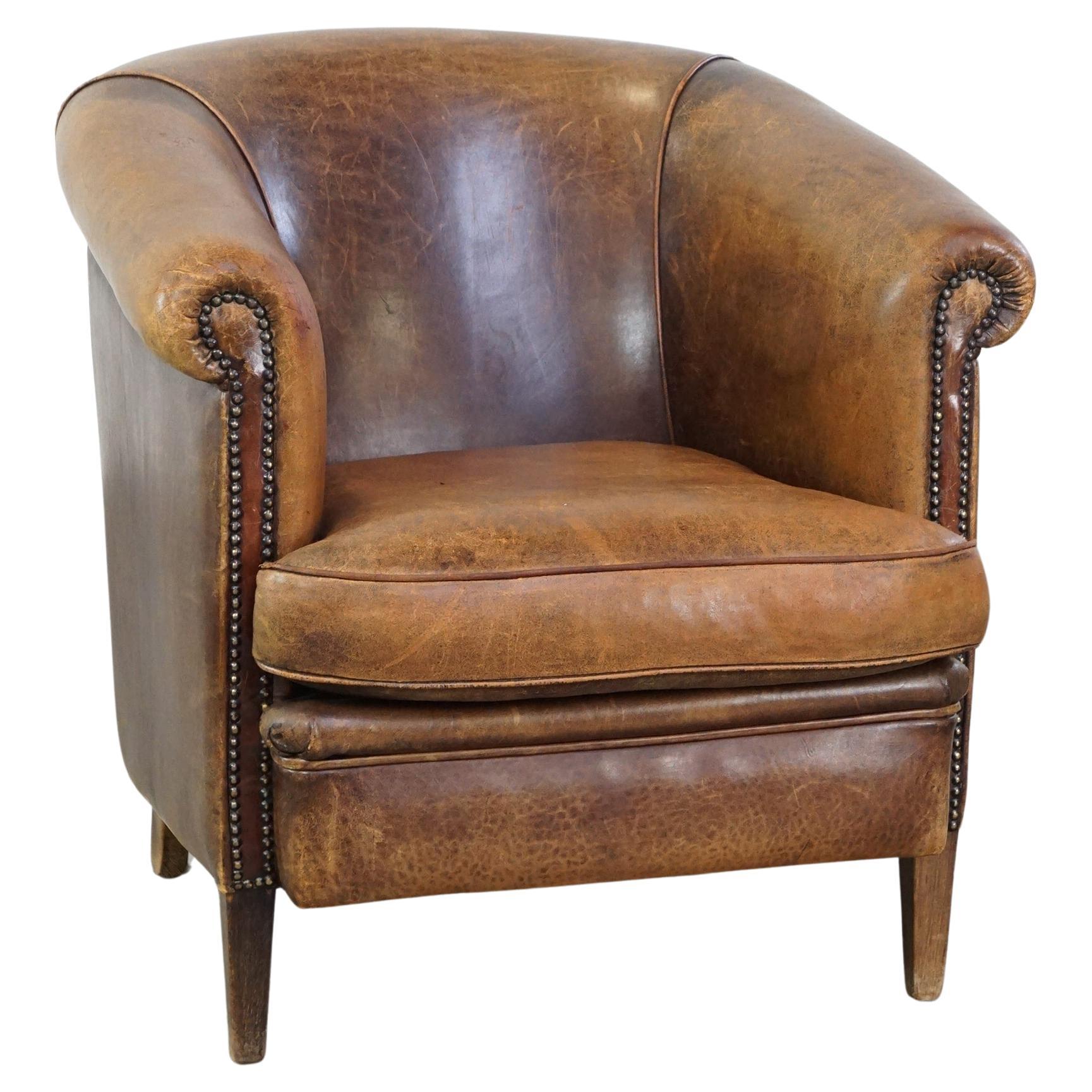 Characterful sheepskin leather club armchair with a luxurious, rustic appearance