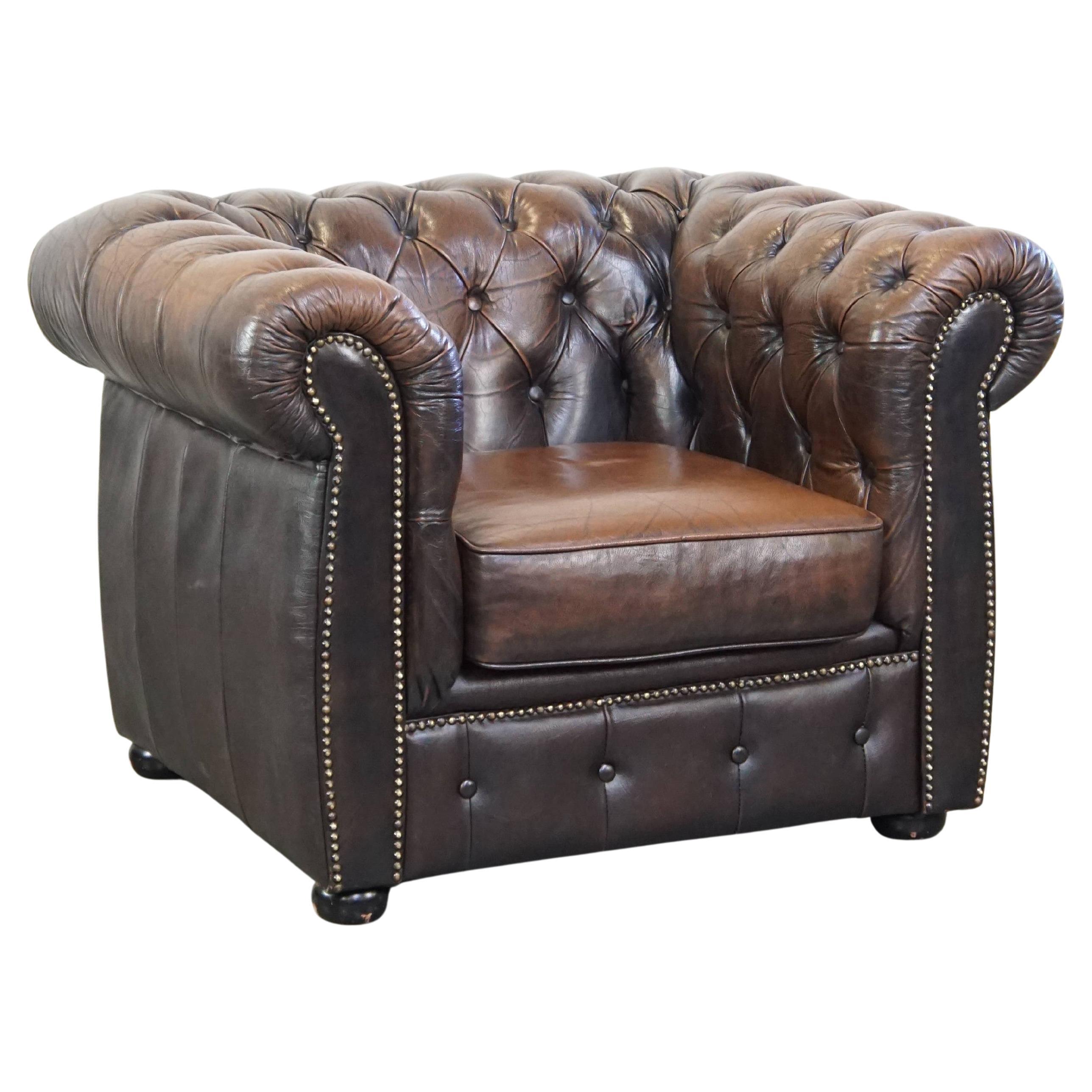 Characterful, stately English Chesterfield armchair made of cowhide leather For Sale