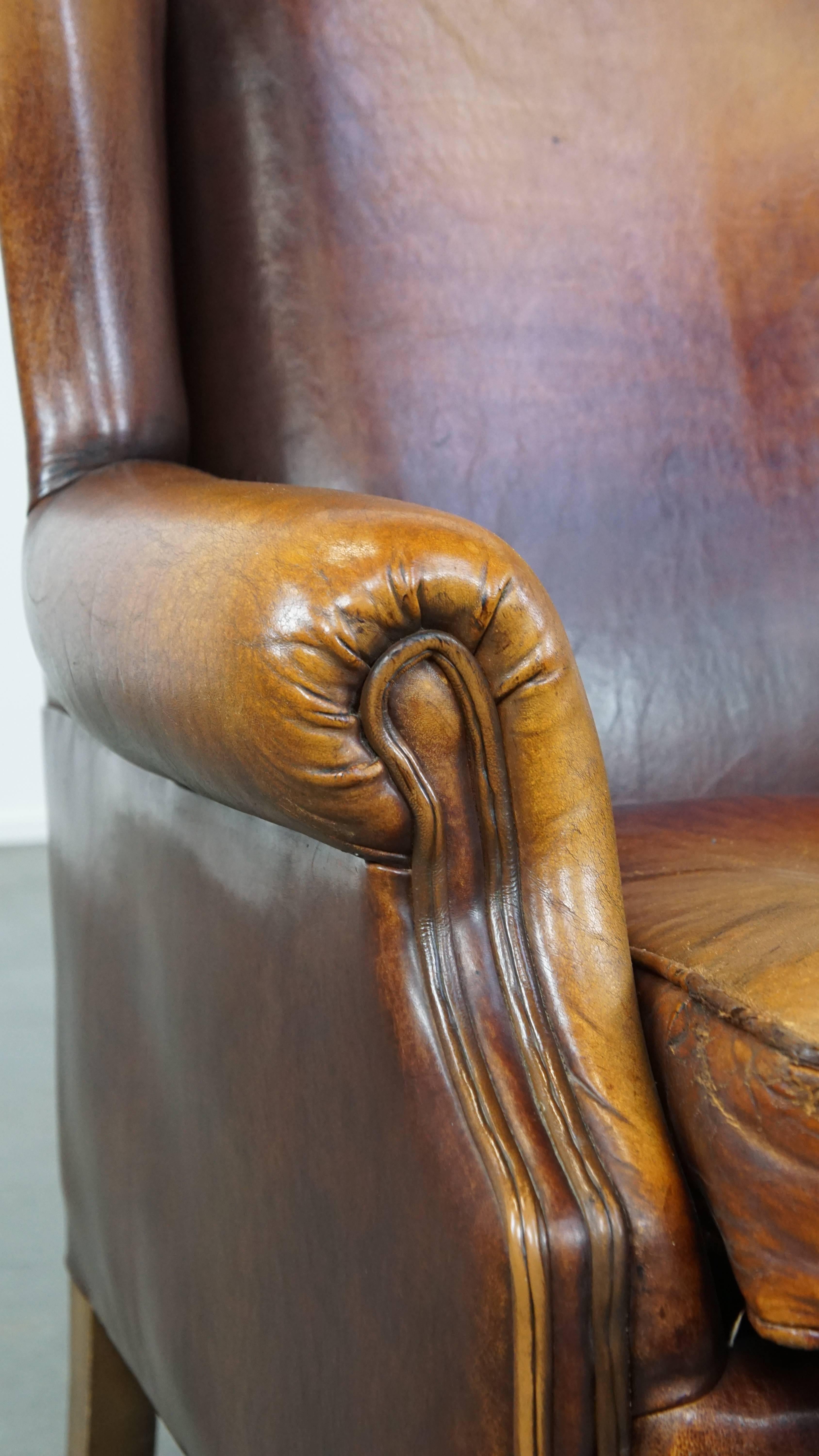 Characterful Vintage Sheepskin Leather Wingback Chair with Beautiful Colors For Sale 4