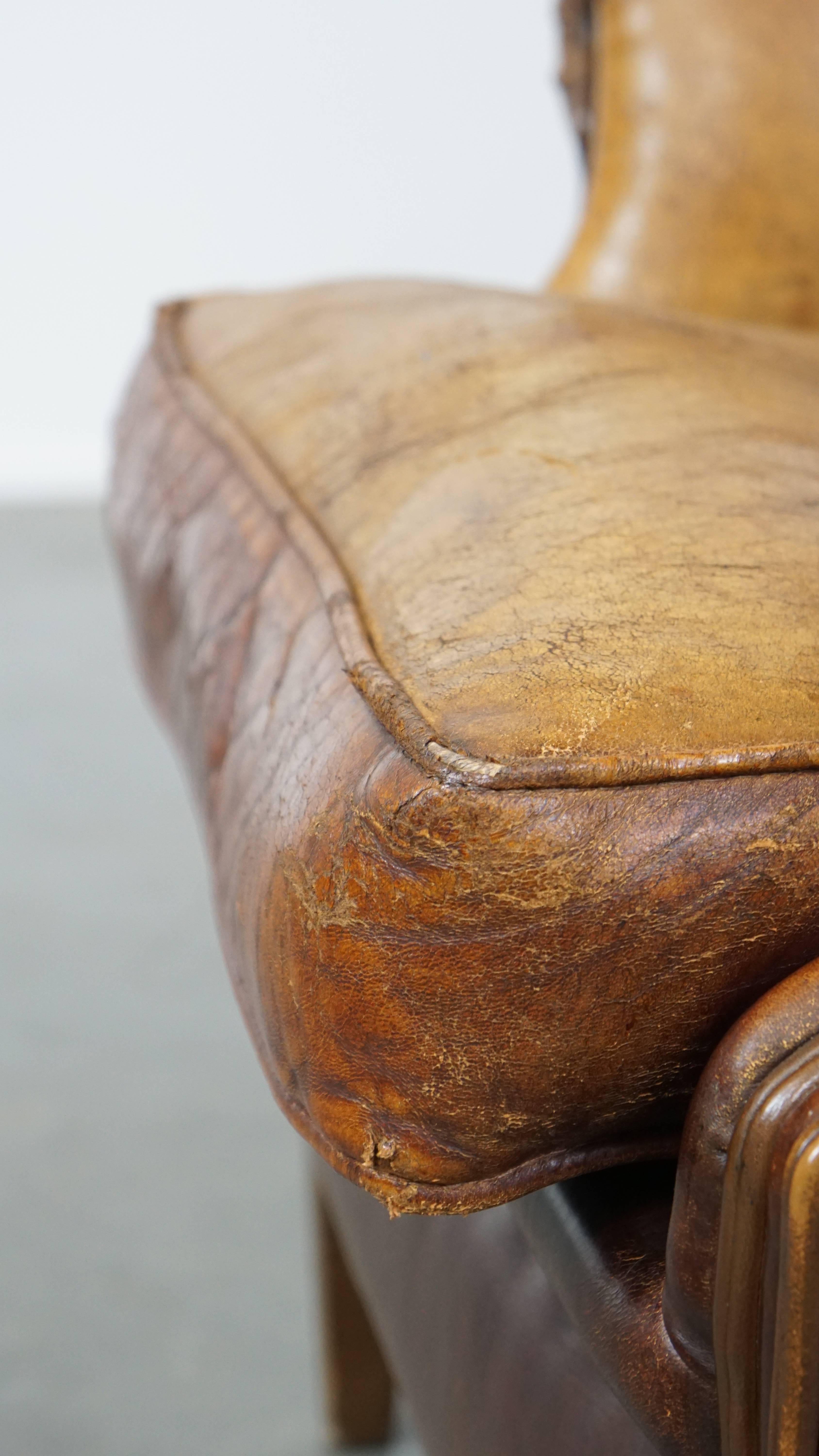 Characterful Vintage Sheepskin Leather Wingback Chair with Beautiful Colors For Sale 9