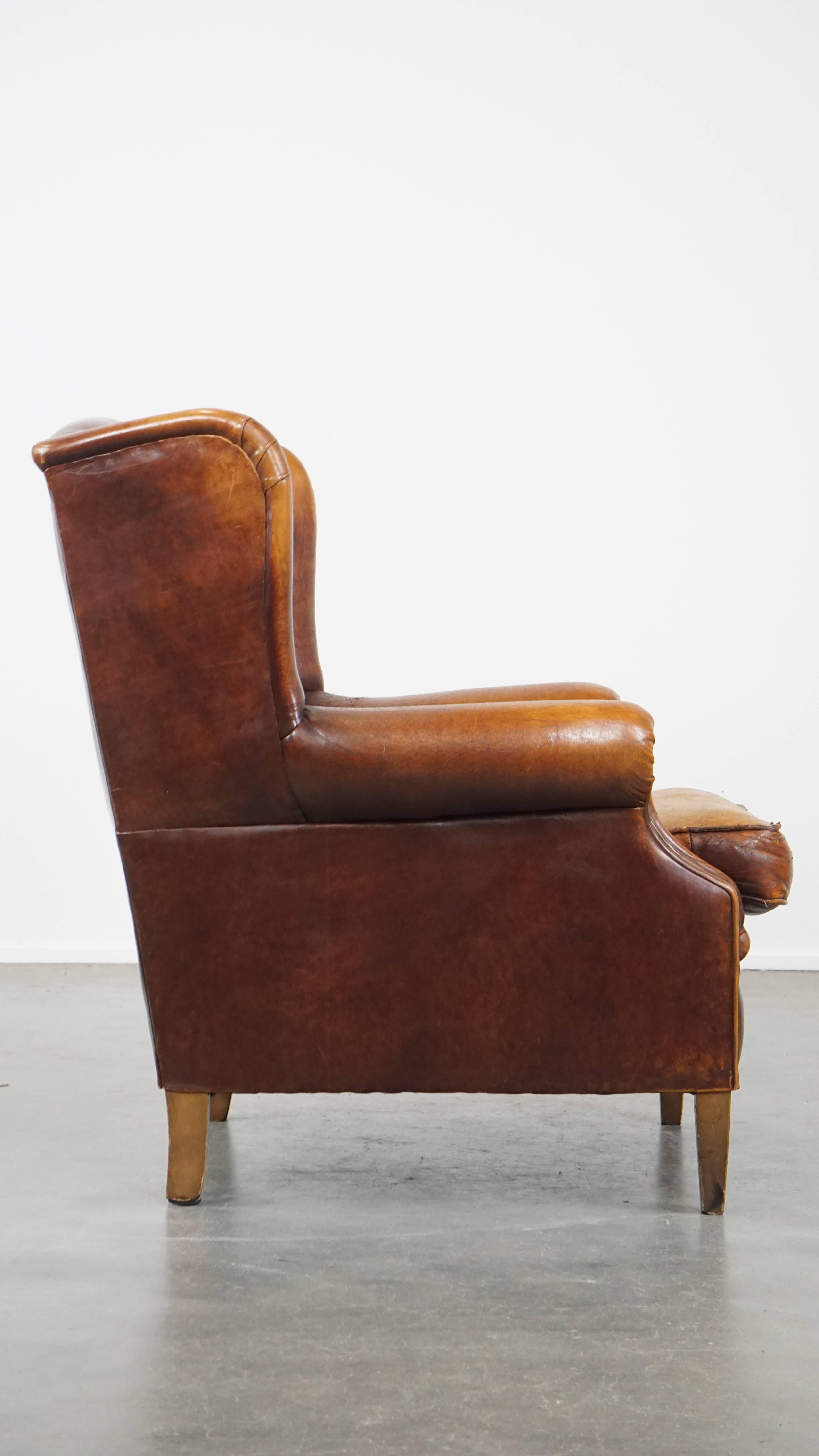 Classical Roman Characterful Vintage Sheepskin Leather Wingback Chair with Beautiful Colors For Sale