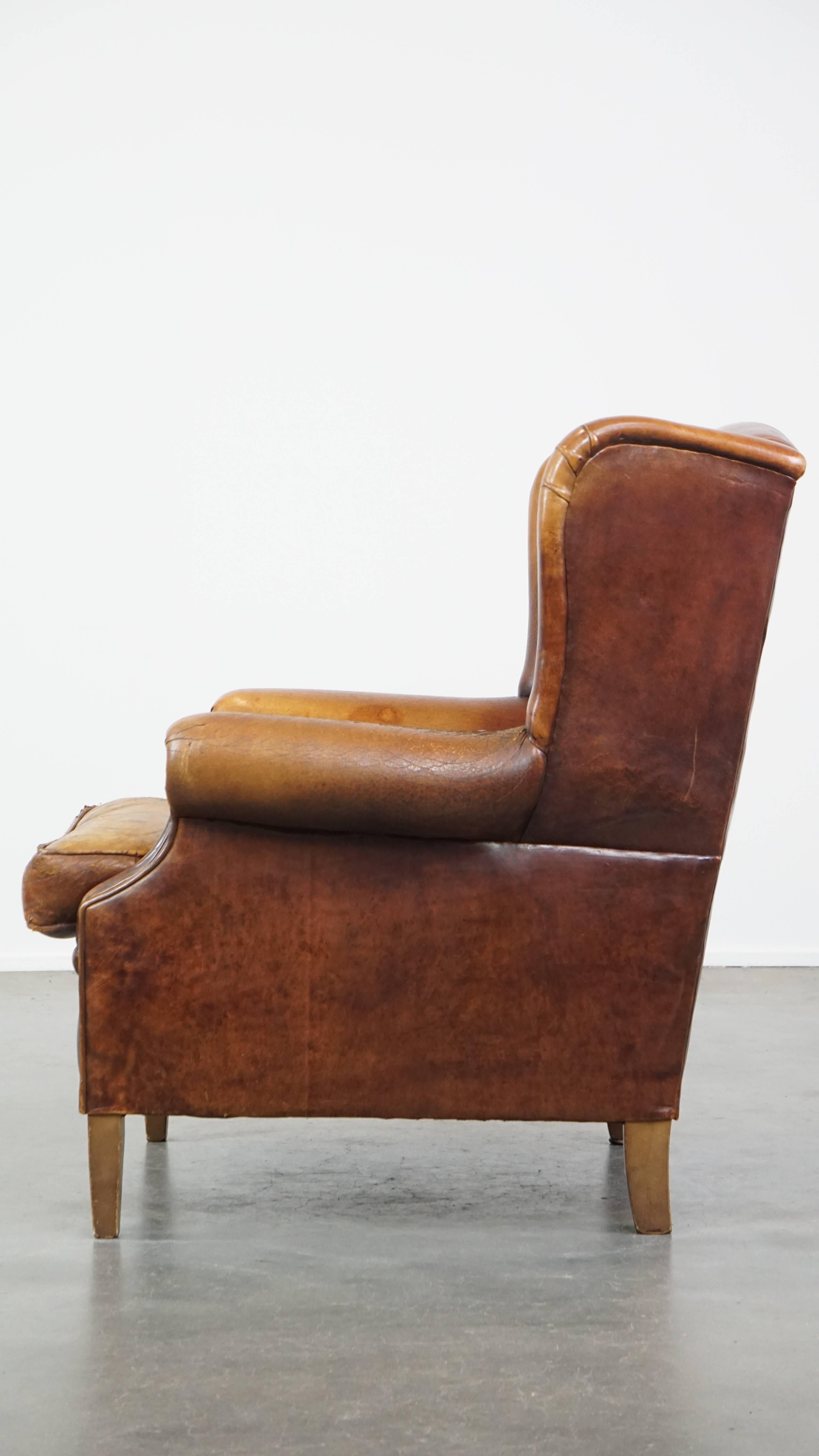 Characterful Vintage Sheepskin Leather Wingback Chair with Beautiful Colors In Fair Condition For Sale In Harderwijk, NL