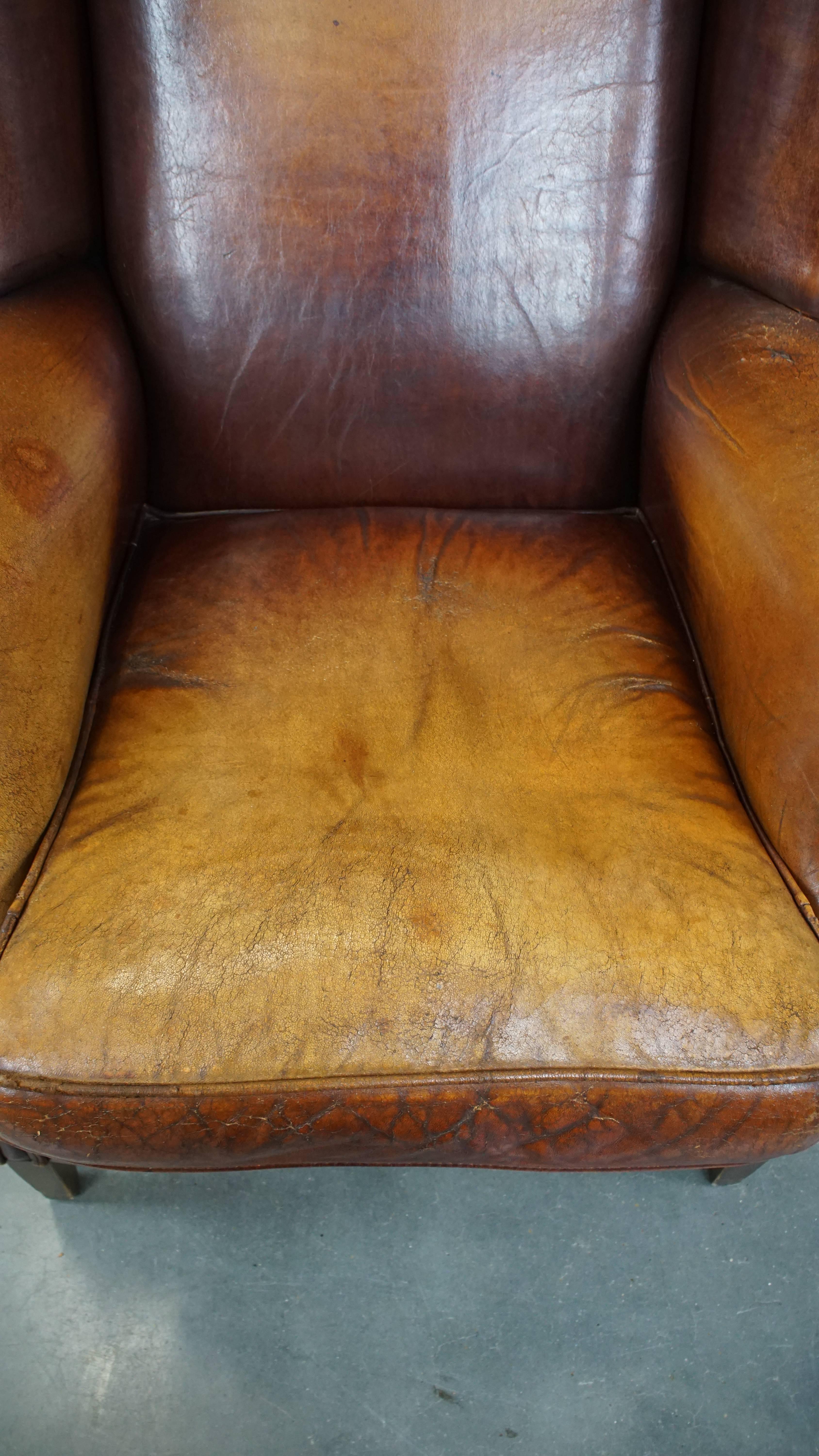 20th Century Characterful Vintage Sheepskin Leather Wingback Chair with Beautiful Colors For Sale
