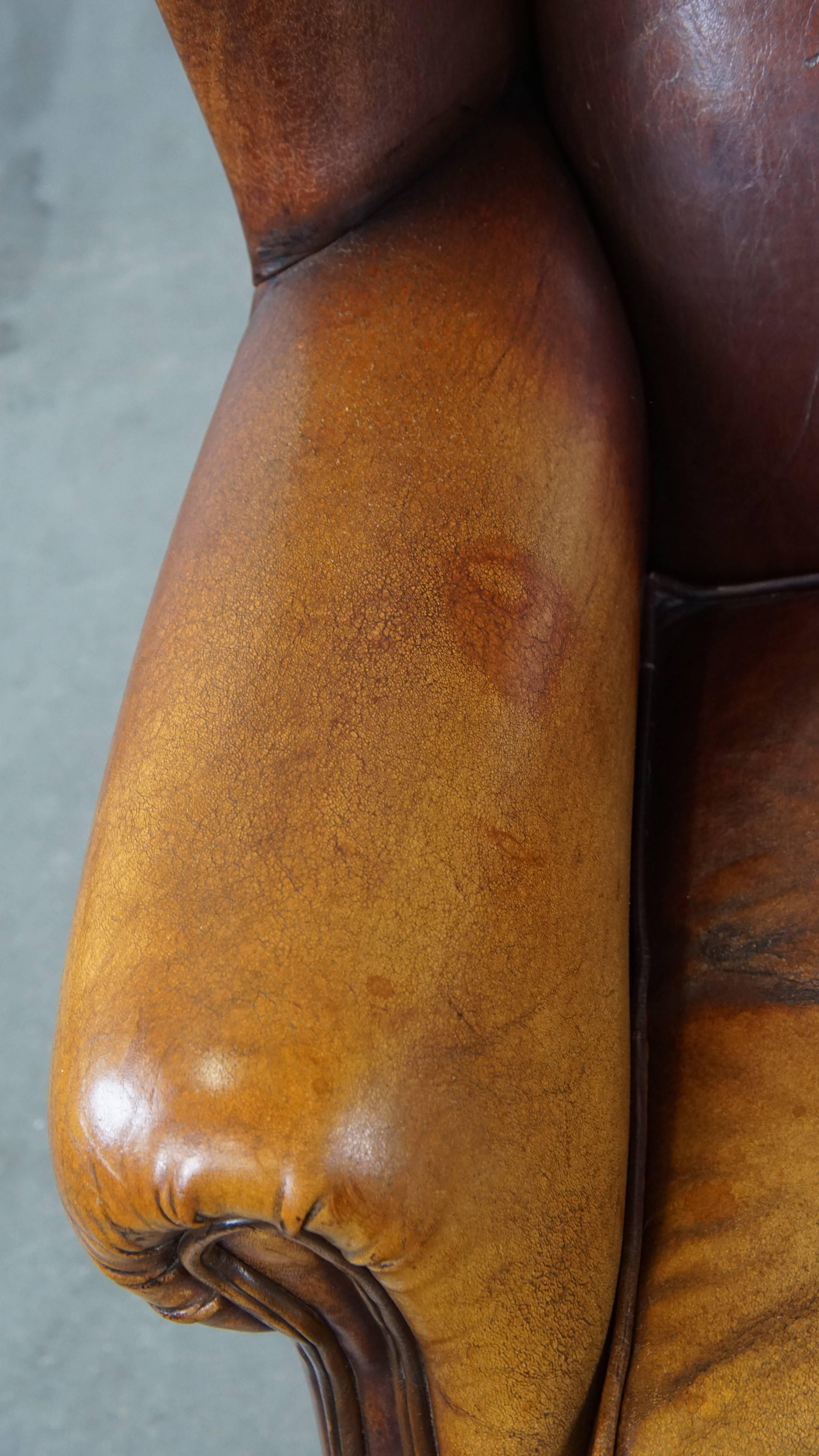 Characterful Vintage Sheepskin Leather Wingback Chair with Beautiful Colors For Sale 1