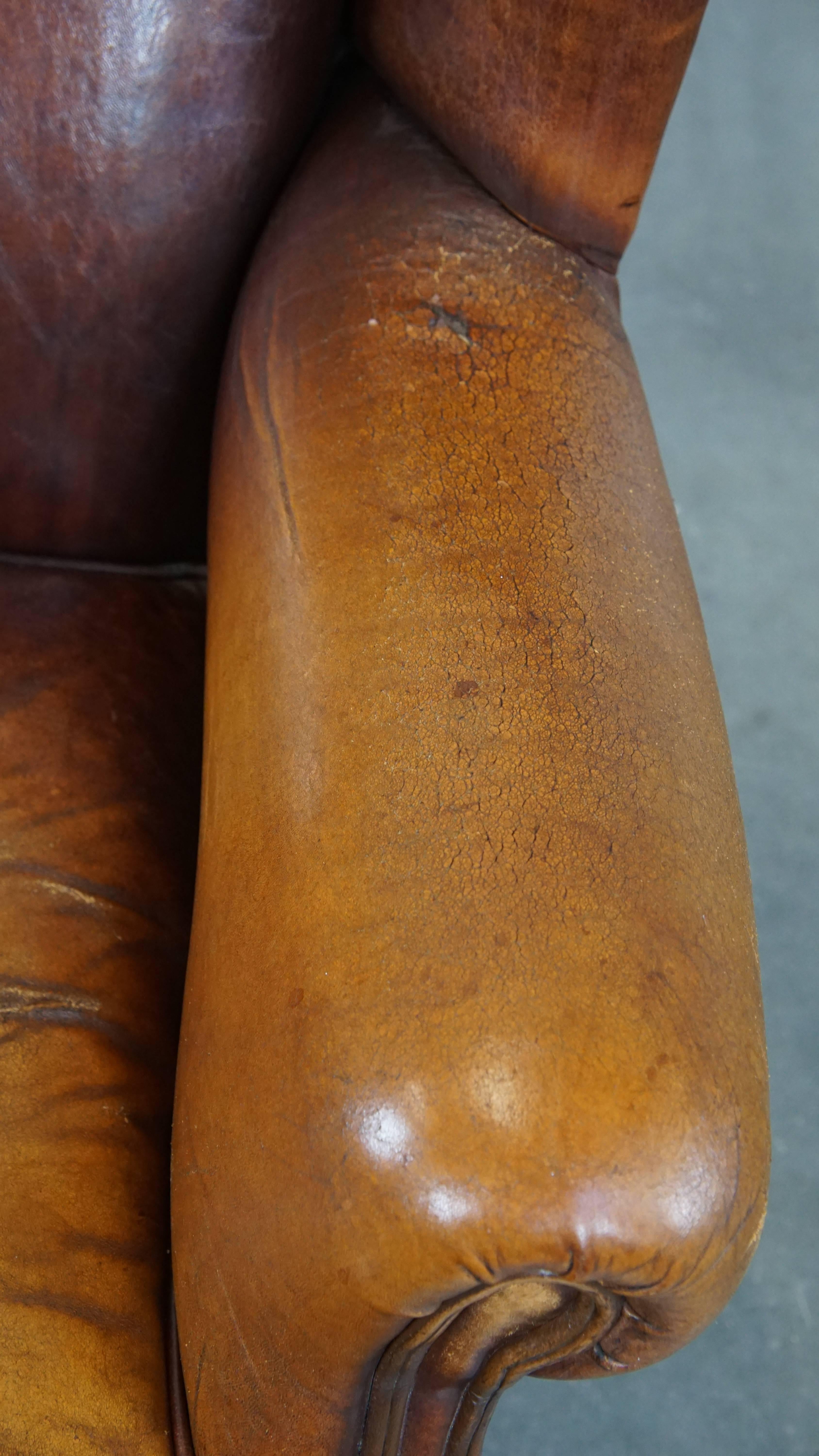 Characterful Vintage Sheepskin Leather Wingback Chair with Beautiful Colors For Sale 2