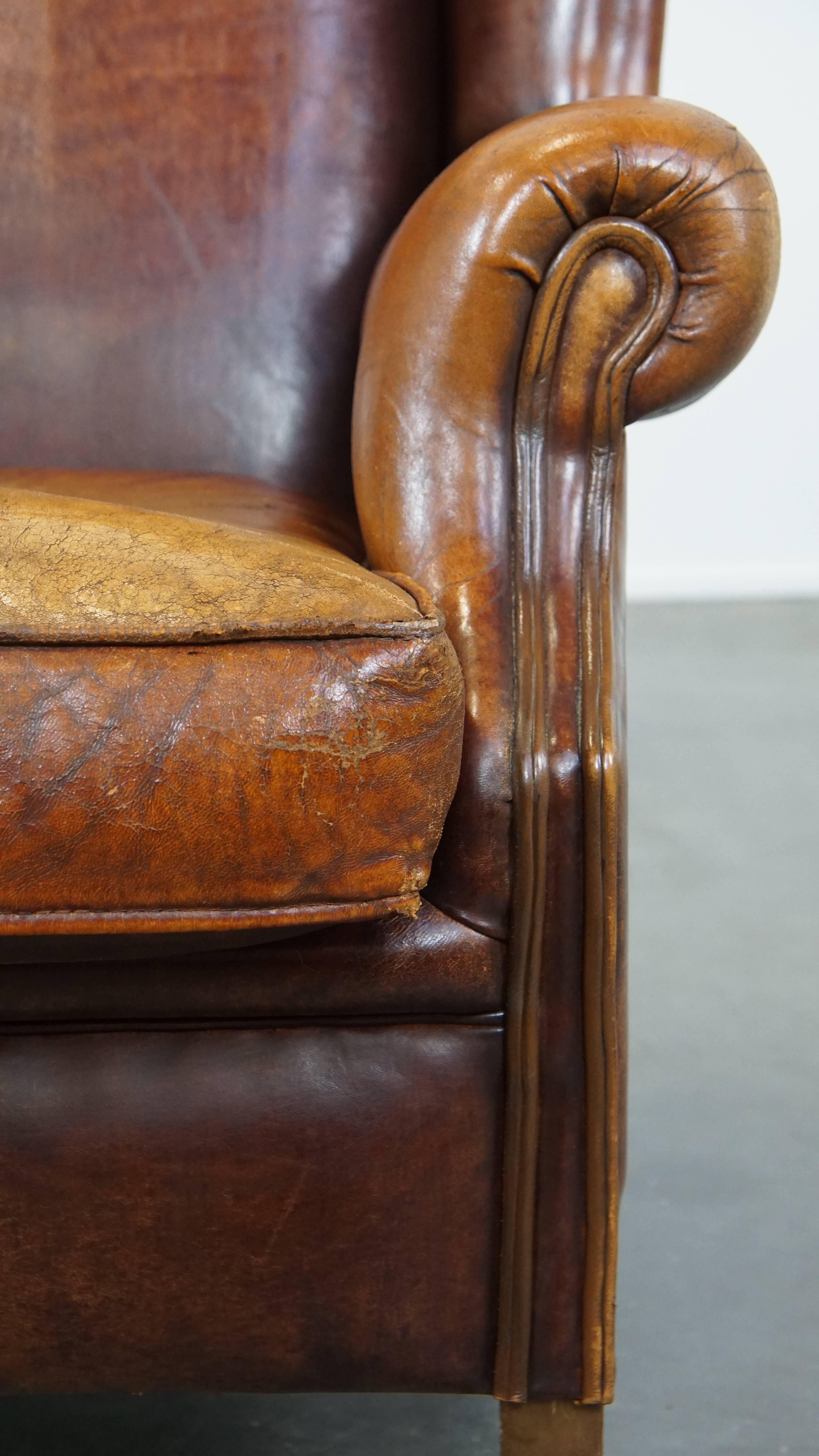 Characterful Vintage Sheepskin Leather Wingback Chair with Beautiful Colors For Sale 3
