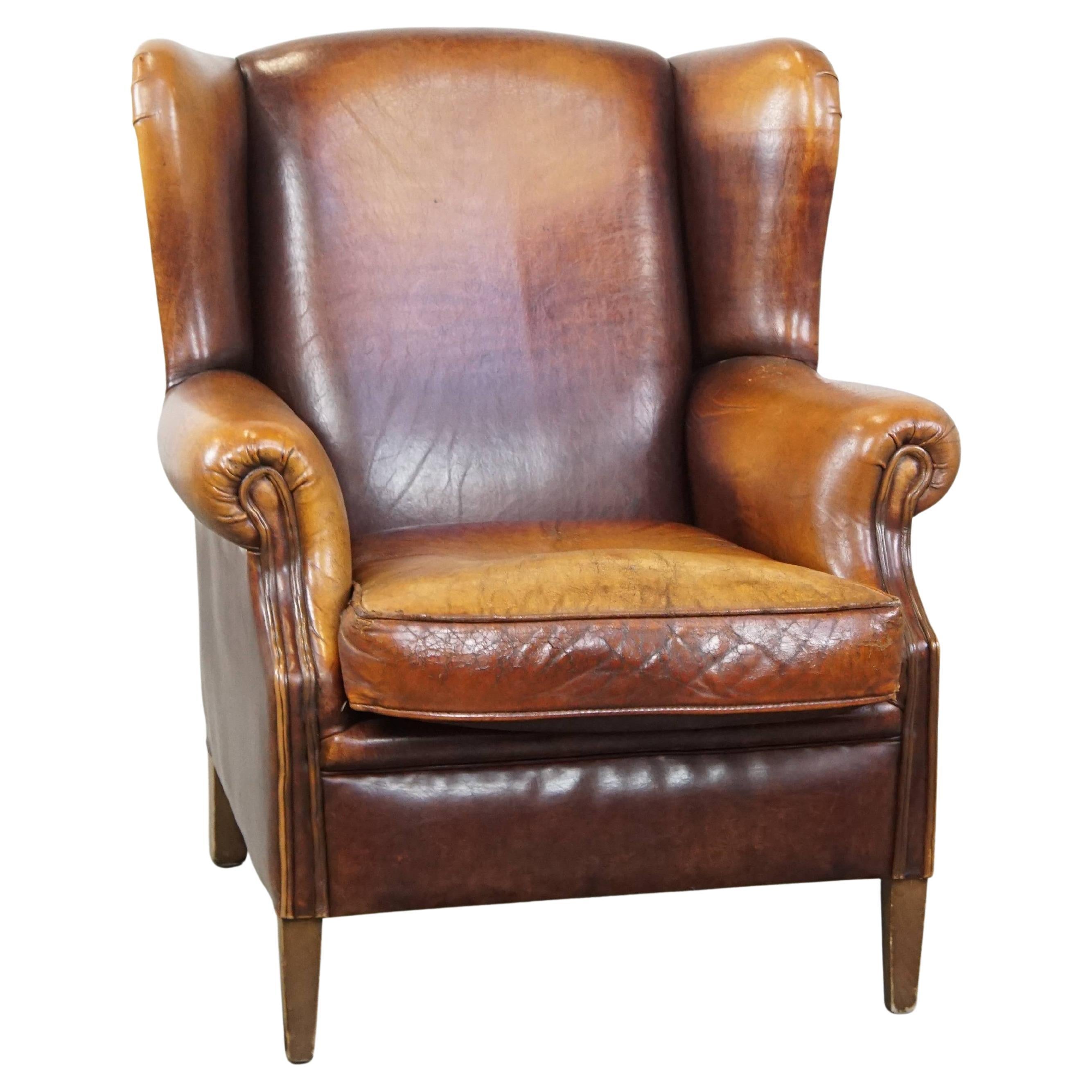 Characterful Vintage Sheepskin Leather Wingback Chair with Beautiful Colors