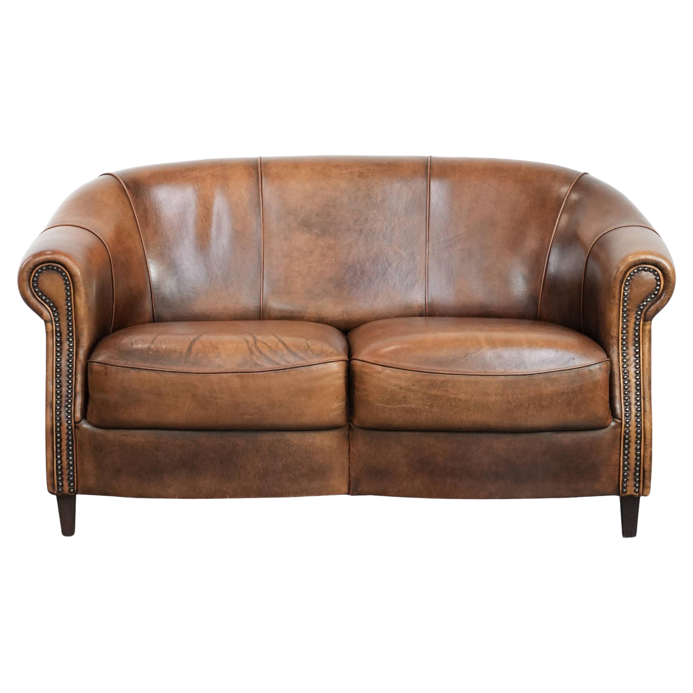 Characterful vintage sturdy 2-seater club sofa made of sheepskin leather For Sale