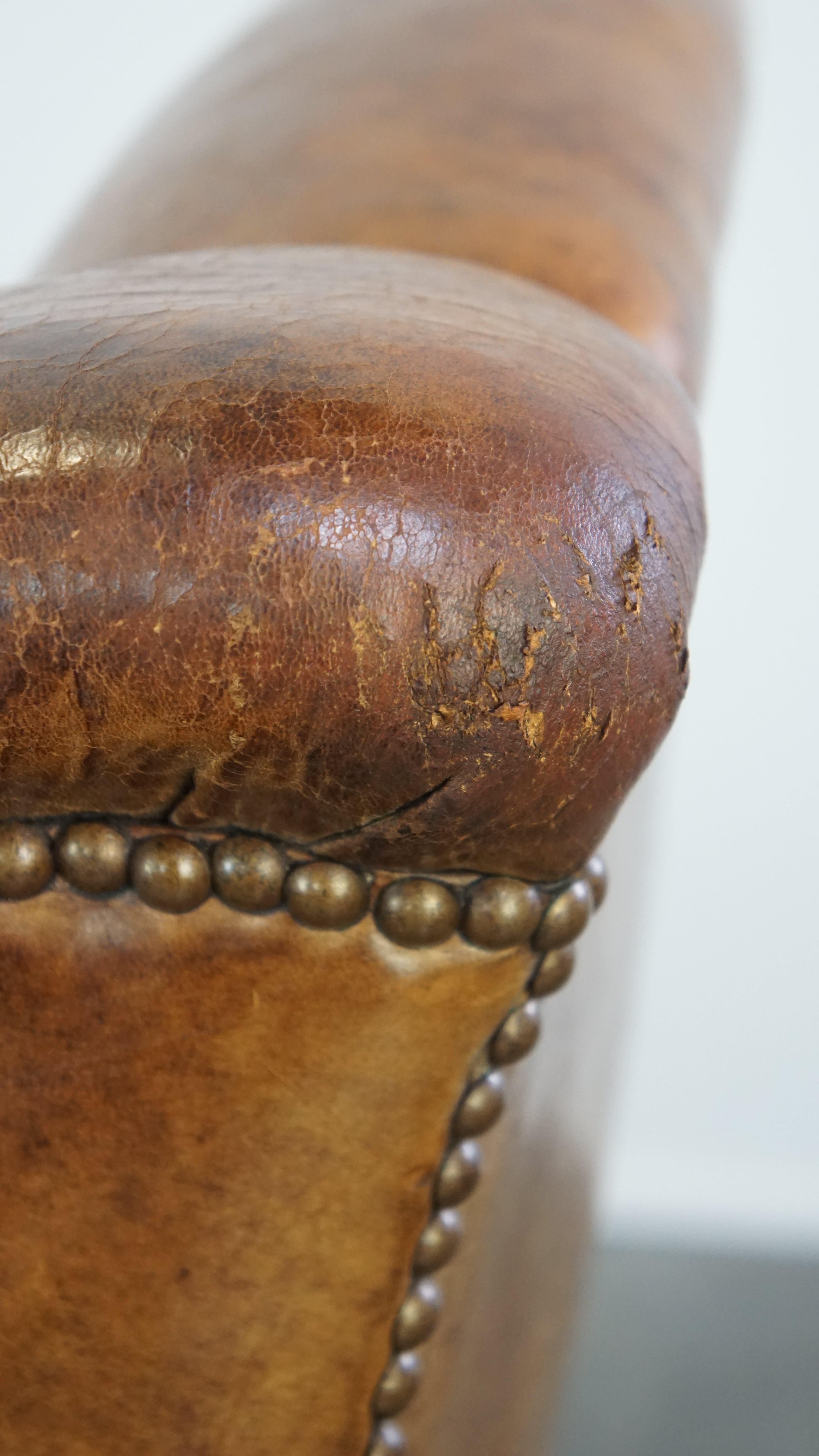 Characteristic antique sheepskin leather armchair with beautiful unique details For Sale 5