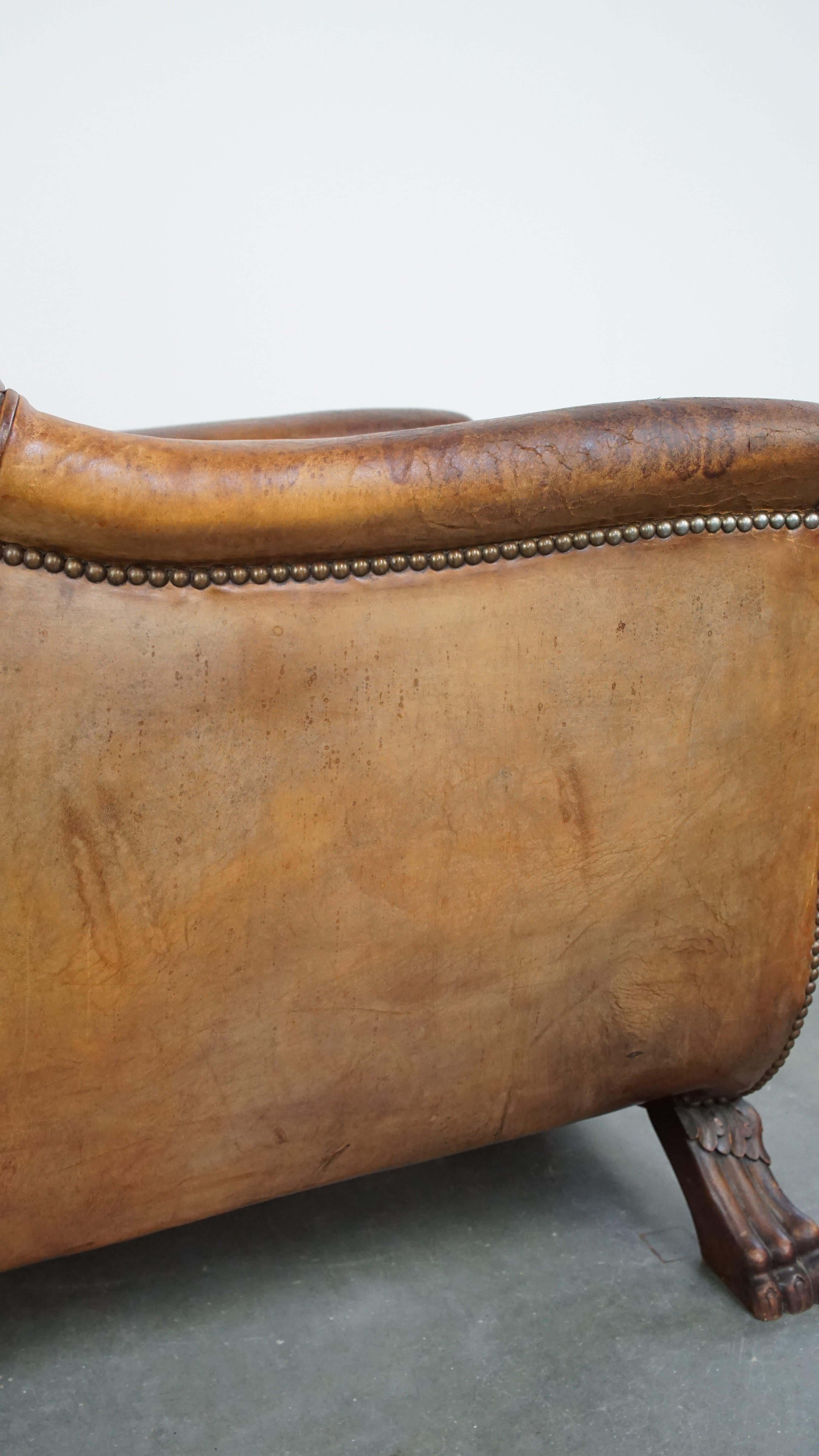 Characteristic antique sheepskin leather armchair with beautiful unique details For Sale 7