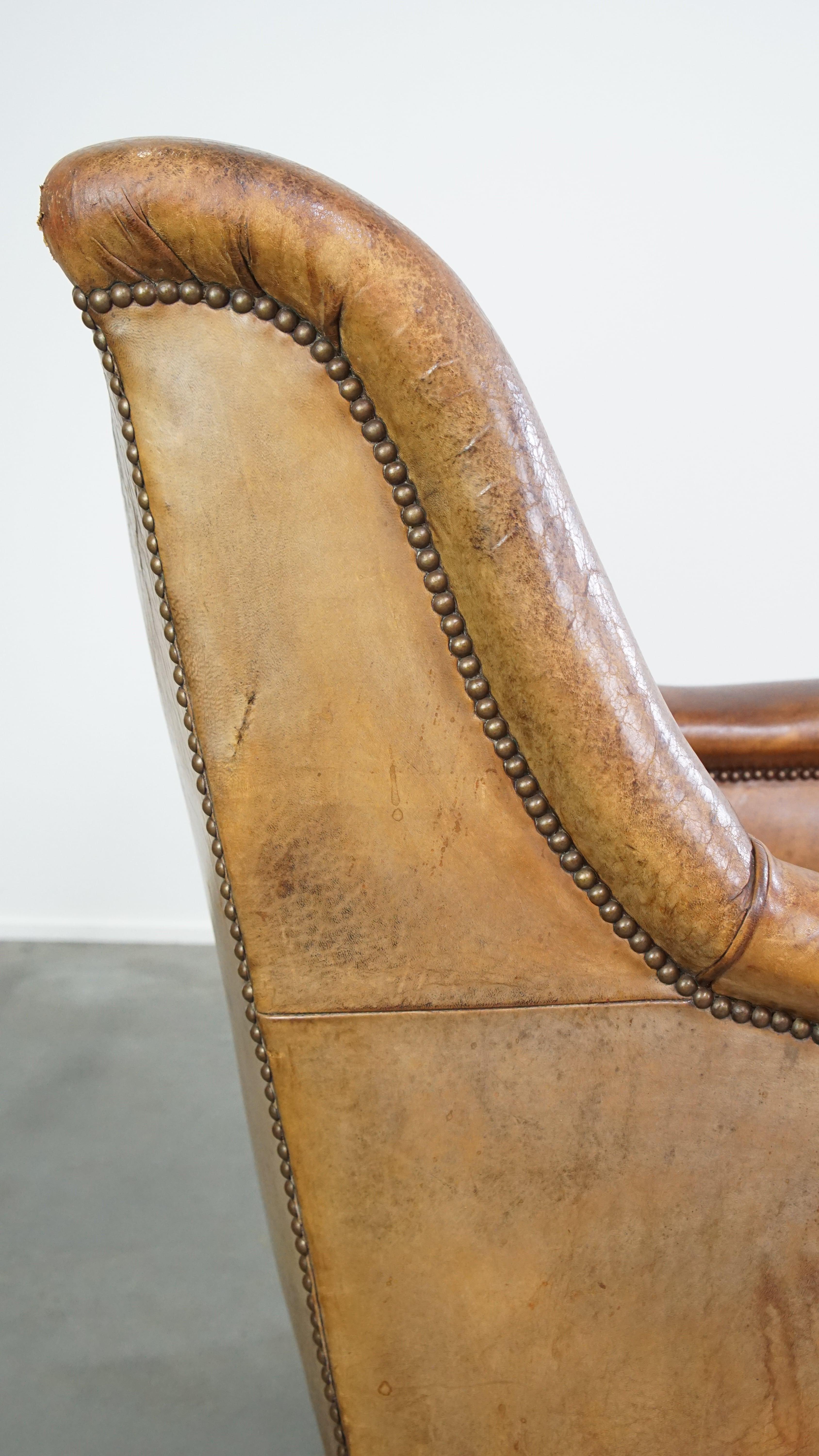 Characteristic antique sheepskin leather armchair with beautiful unique details For Sale 8