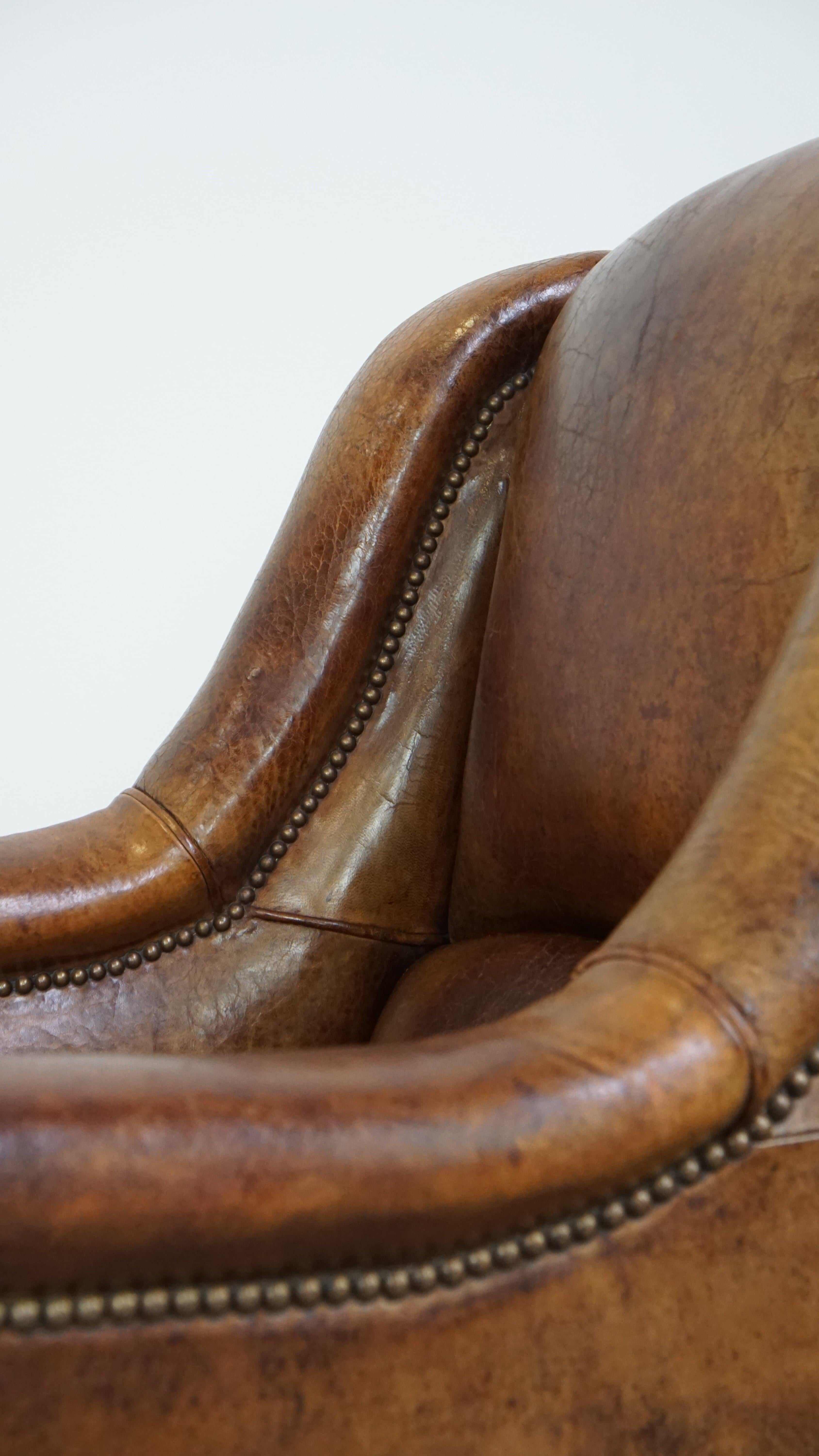 Characteristic antique sheepskin leather armchair with beautiful unique details For Sale 3