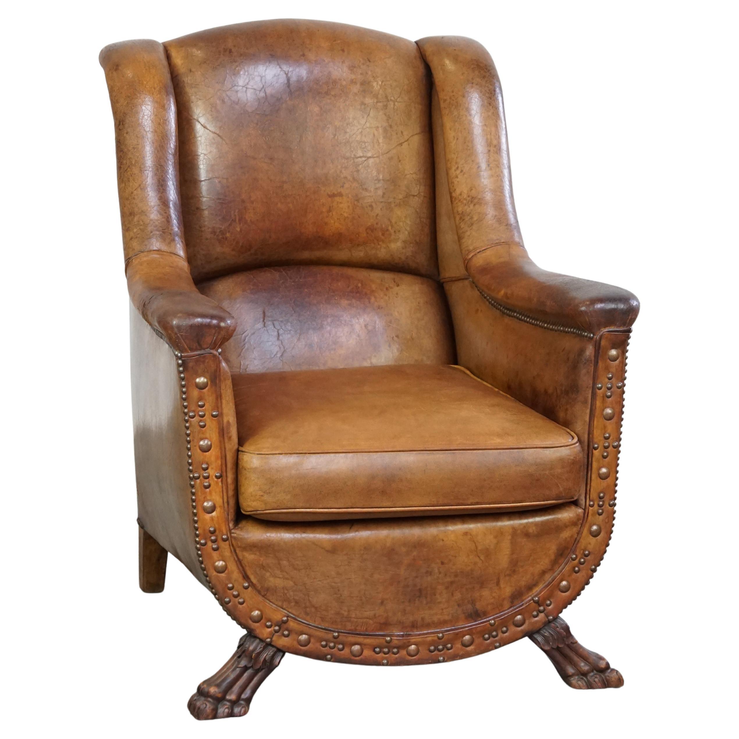 Characteristic antique sheepskin leather armchair with beautiful unique details