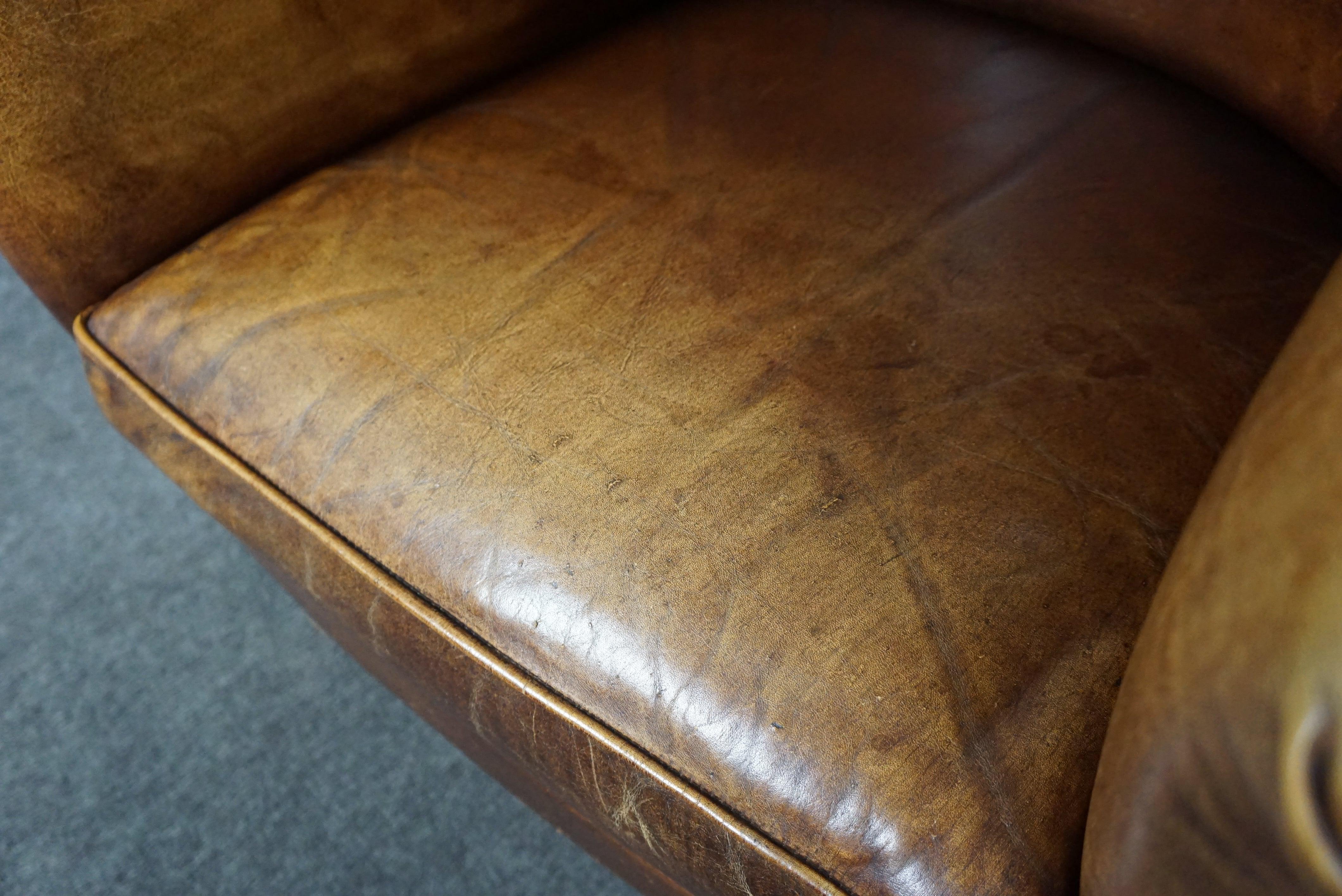 Characteristic club chair made of cowhide leather For Sale 4