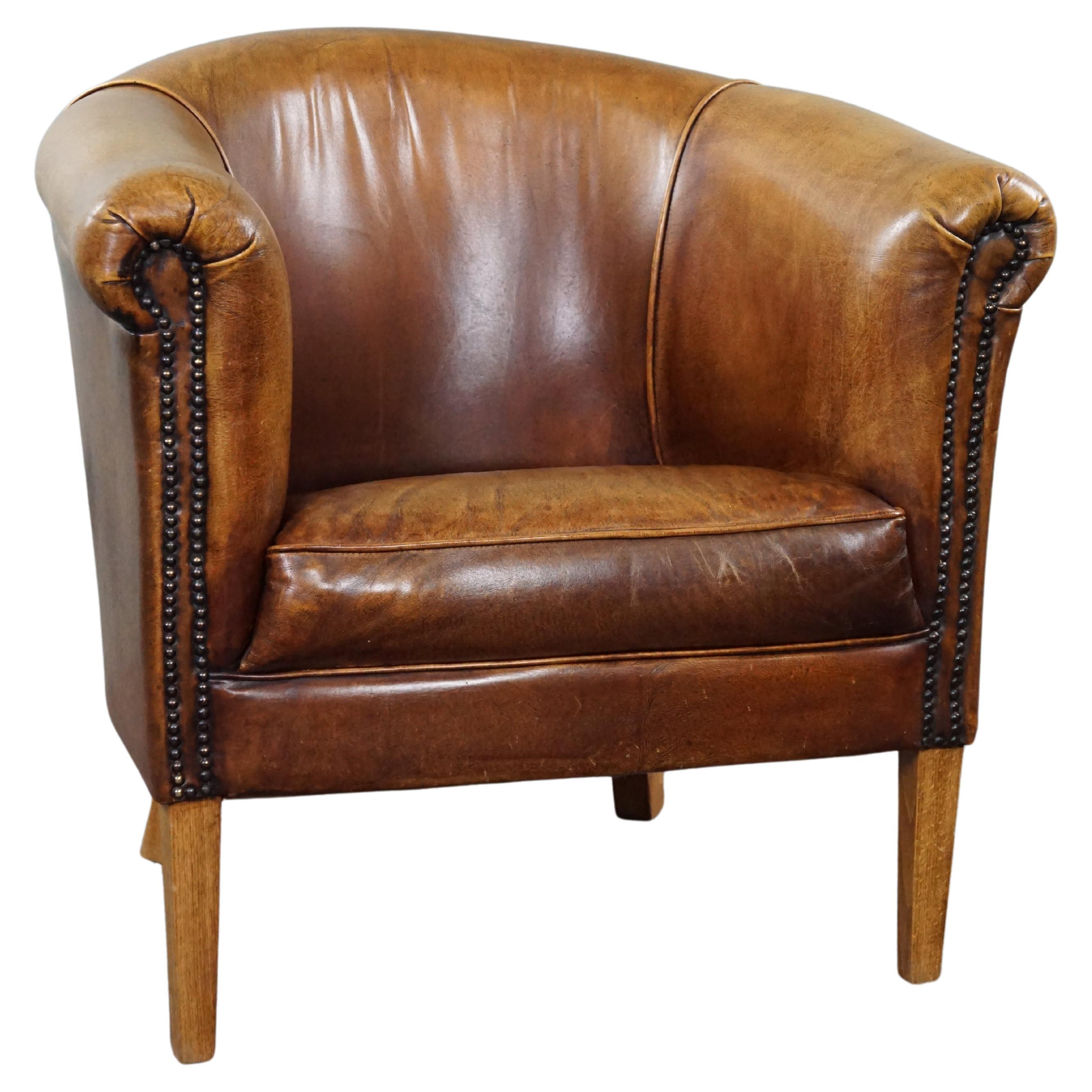 Characteristic club chair made of cowhide leather For Sale