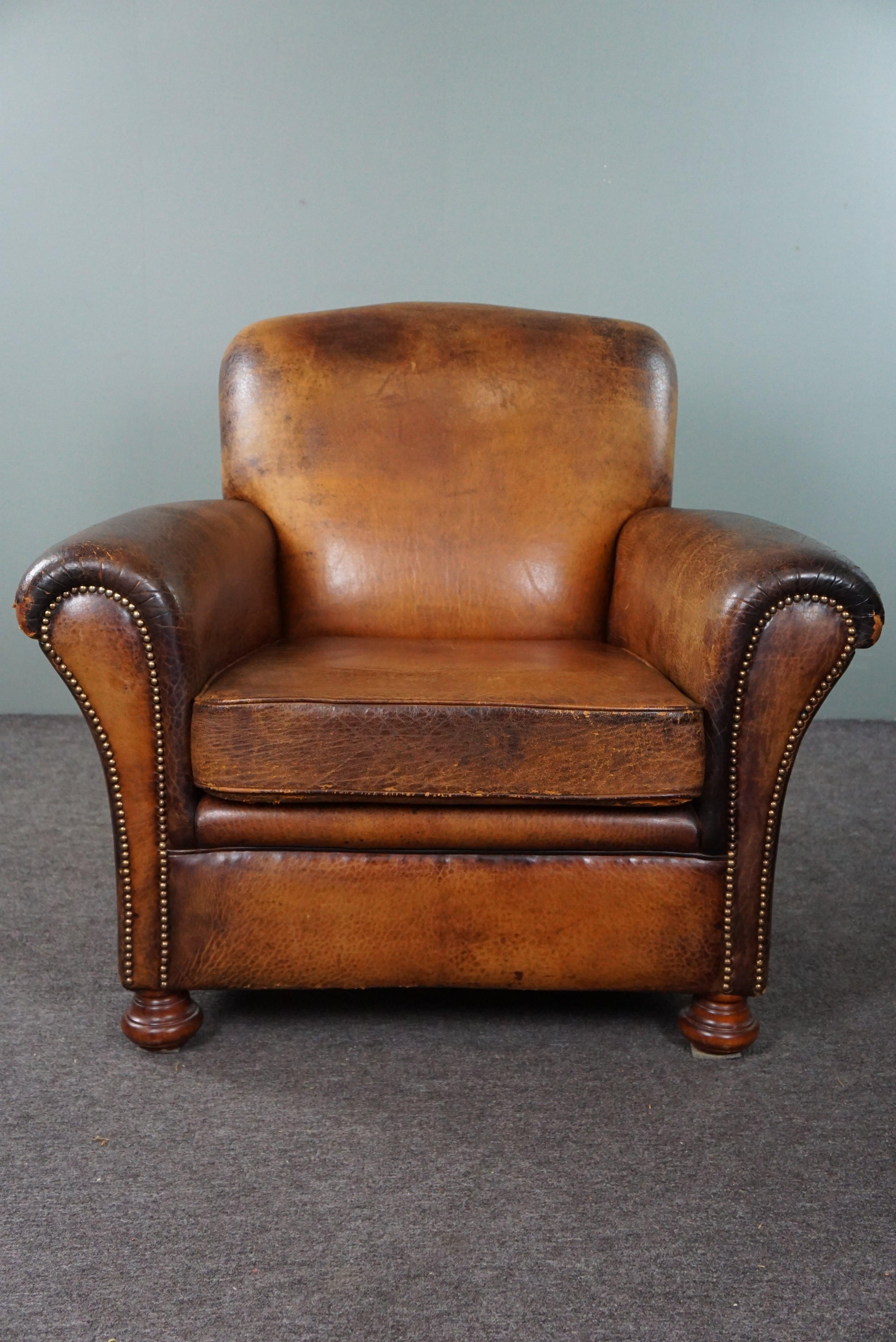 Offered is this armchair exudes character. This stunning sheep leather armchair offers a seating experience that few can match.
But it's not just the comfort that sets this armchair apart; its appearance and acquired patina from experience make it a