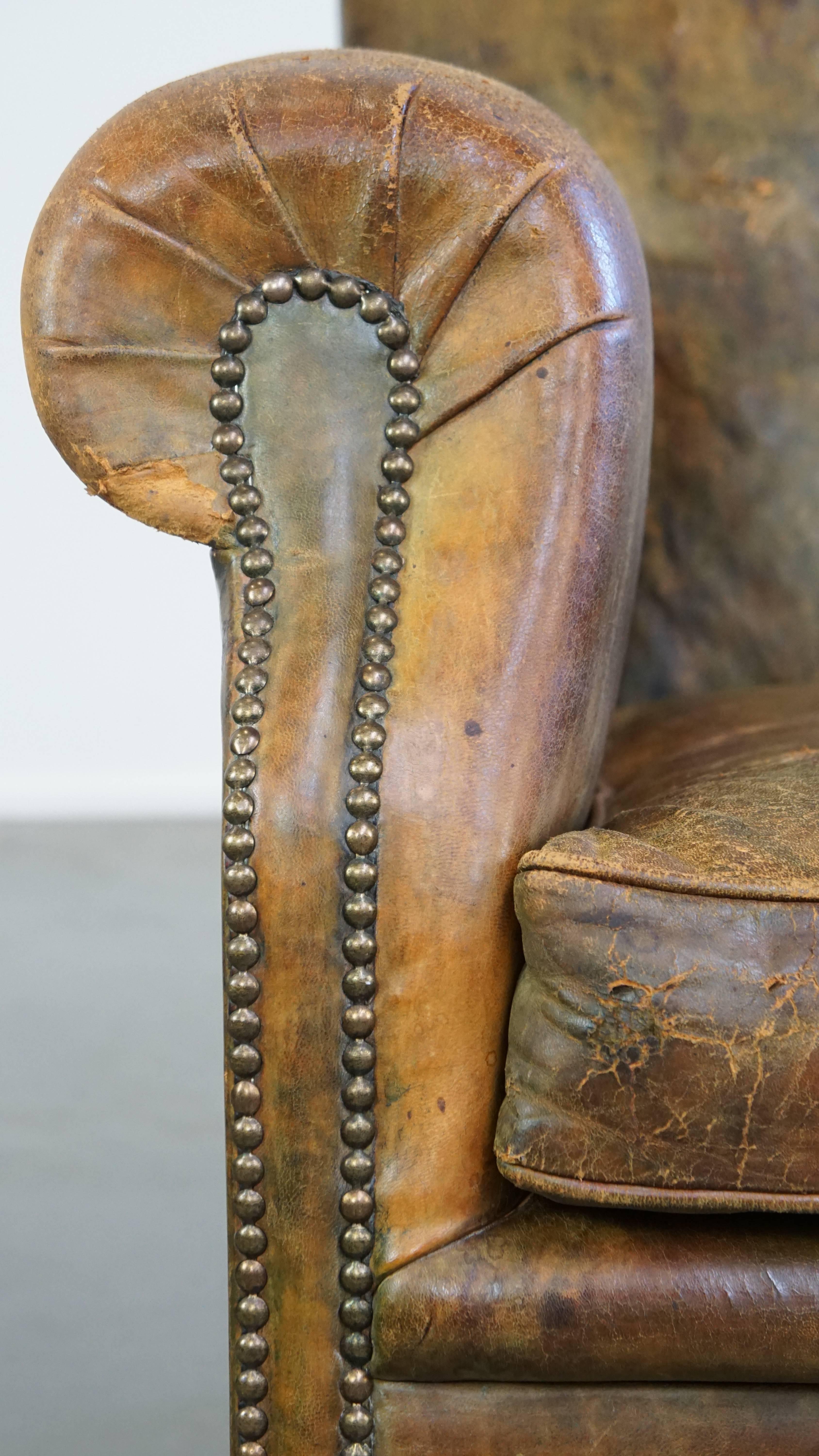 Characteristic unique green antique English leather armchair on wheels For Sale 8