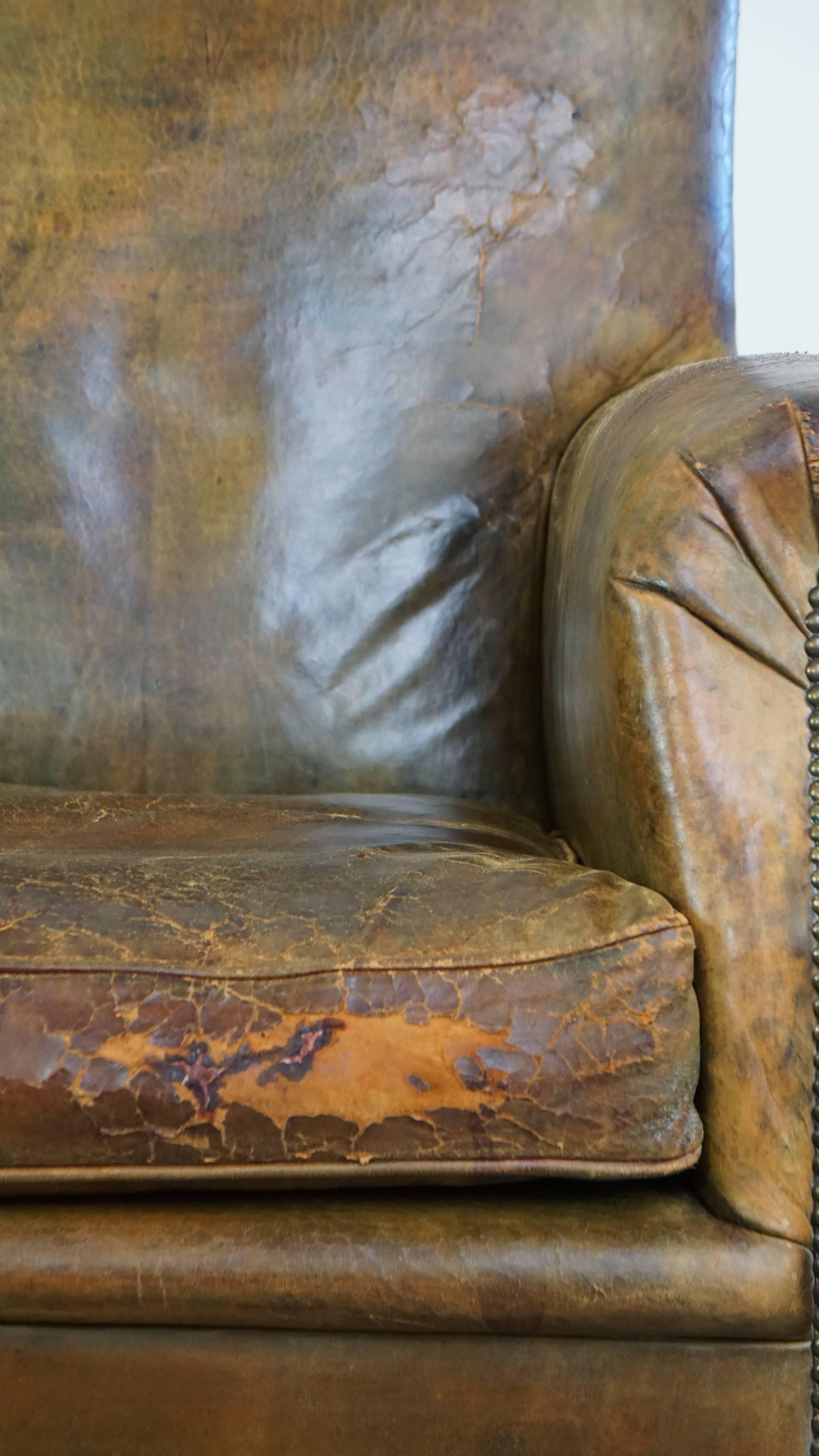 Characteristic unique green antique English leather armchair on wheels For Sale 9