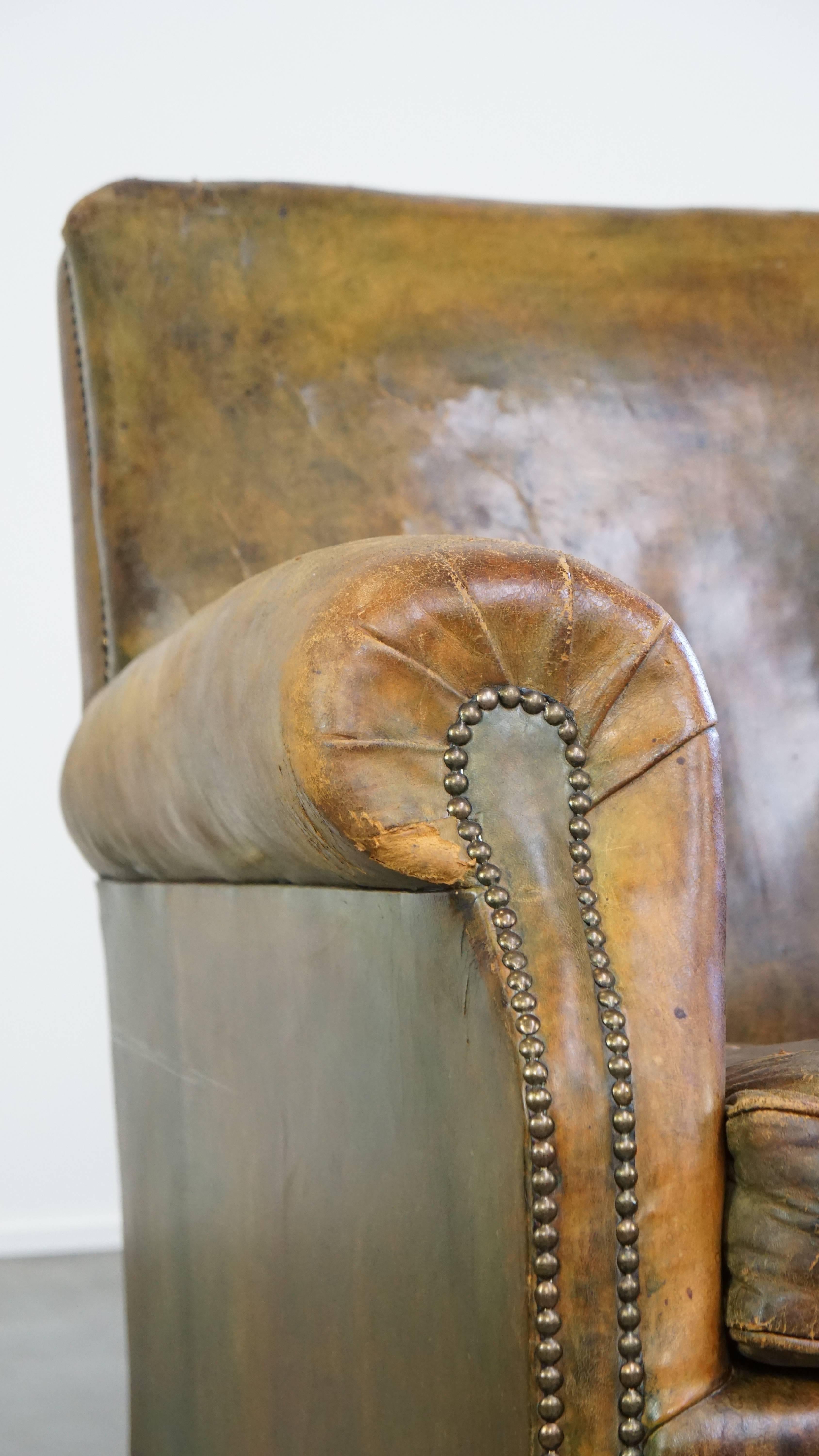 Characteristic unique green antique English leather armchair on wheels For Sale 10