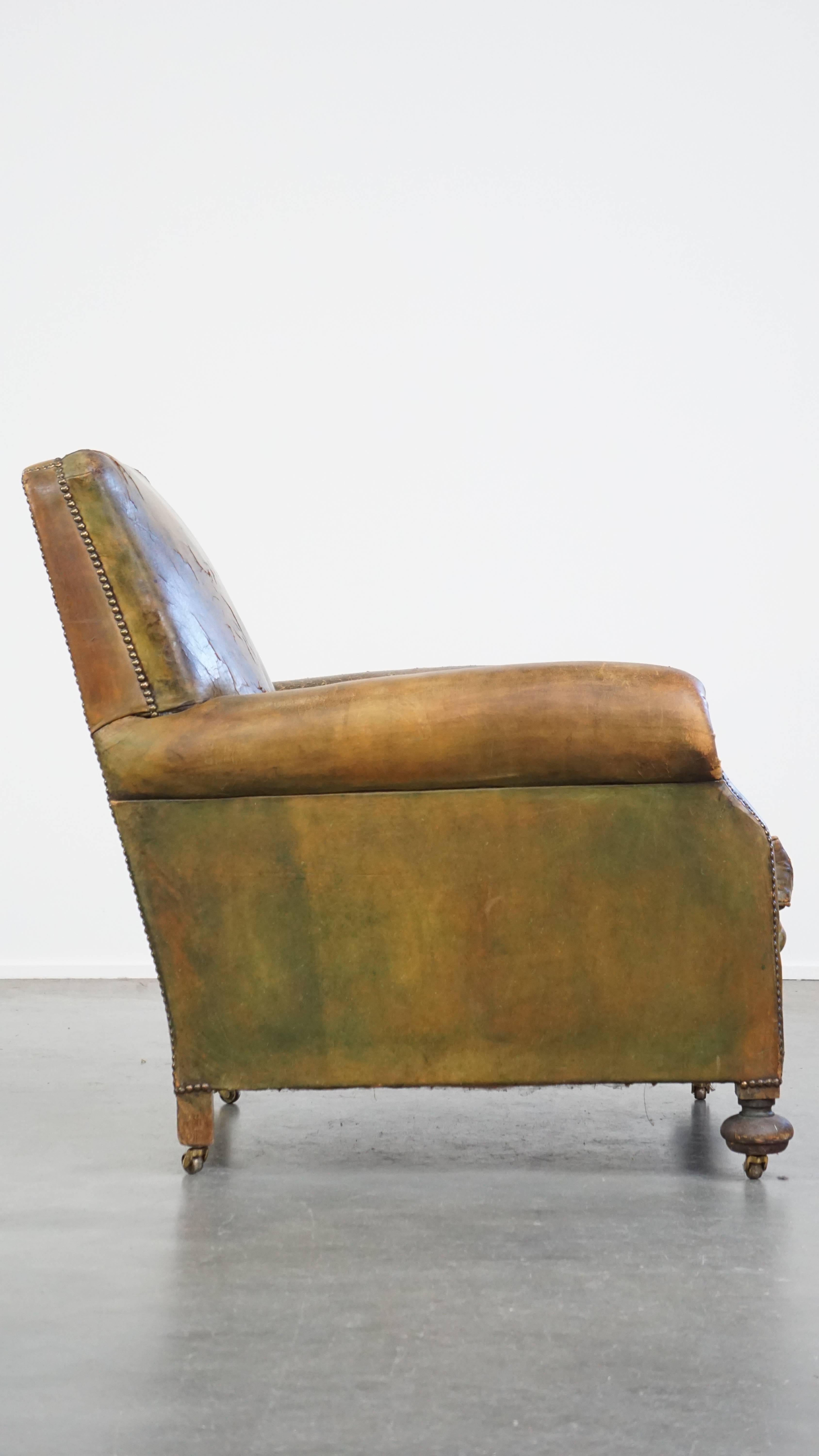 Hand-Crafted Characteristic unique green antique English leather armchair on wheels For Sale