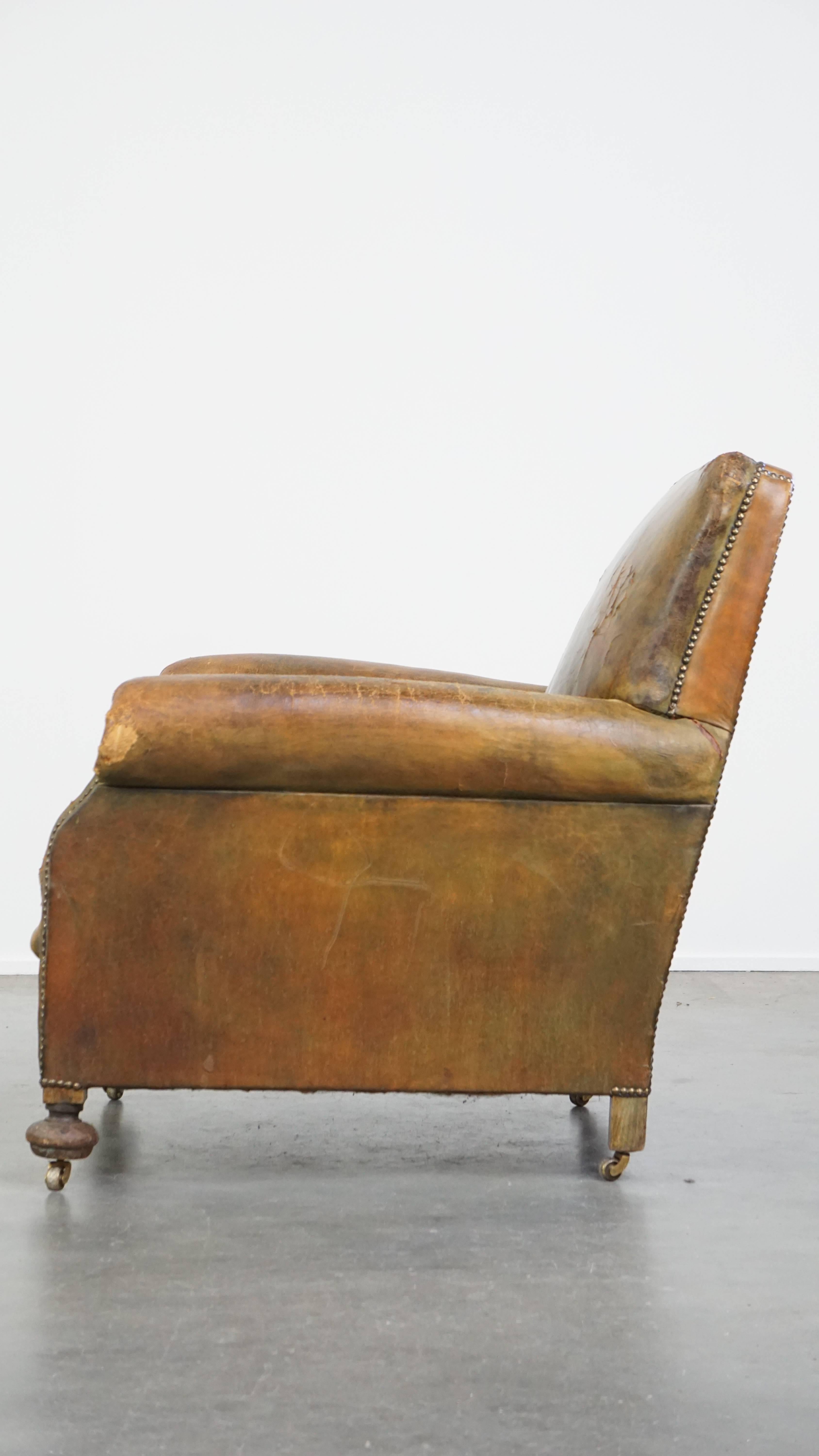 19th Century Characteristic unique green antique English leather armchair on wheels For Sale
