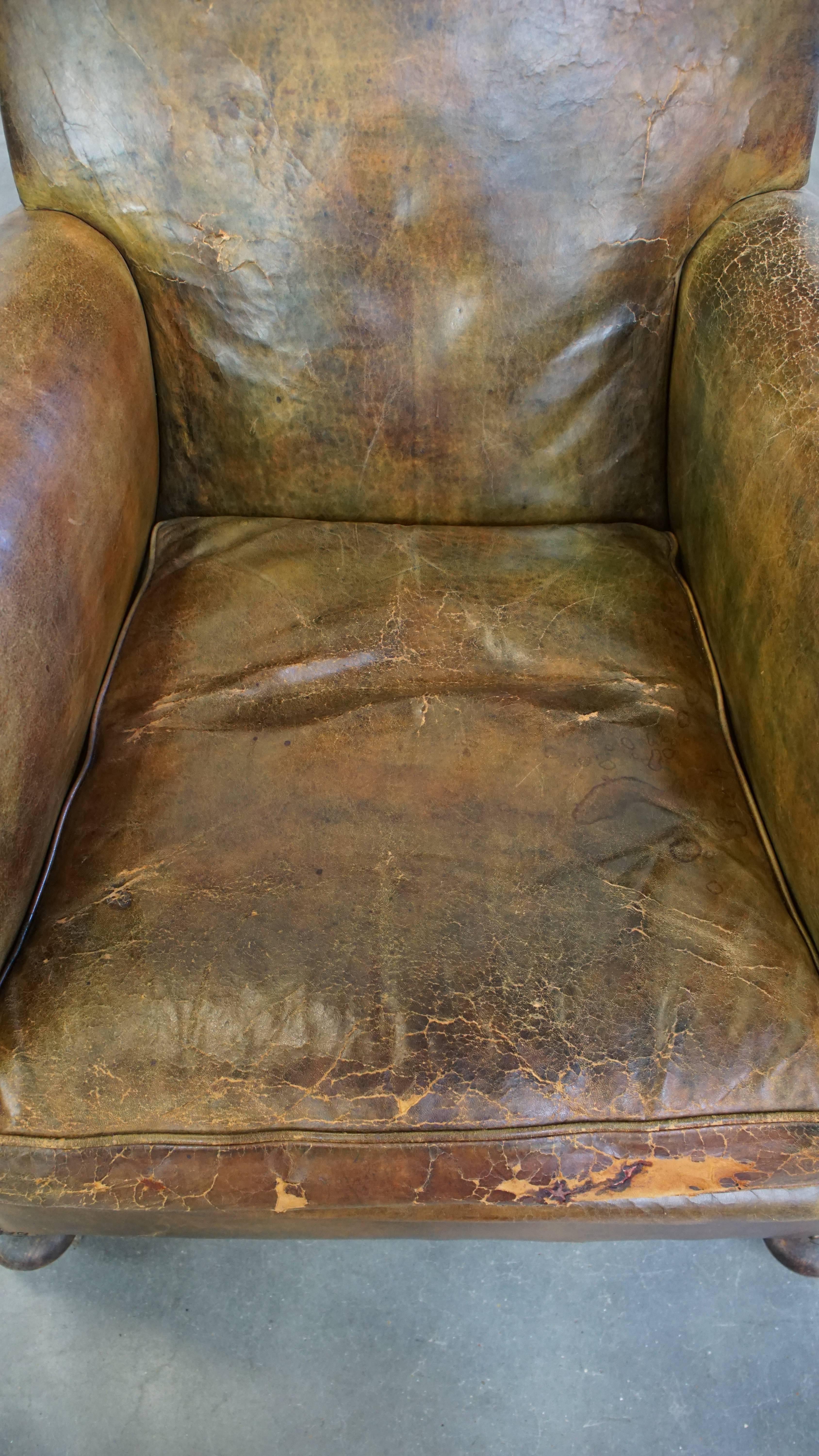 Cowhide Characteristic unique green antique English leather armchair on wheels For Sale