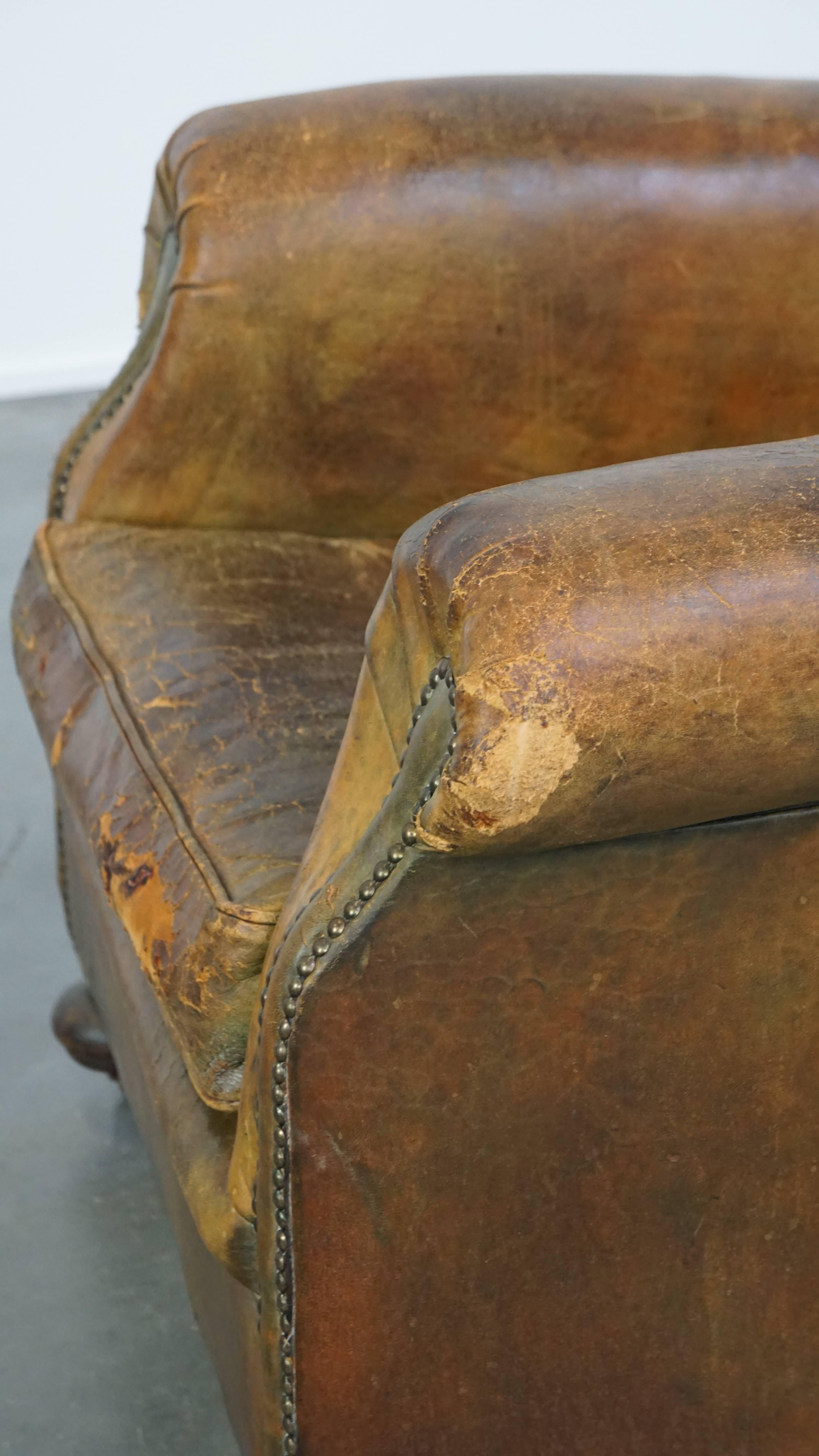 Characteristic unique green antique English leather armchair on wheels For Sale 3