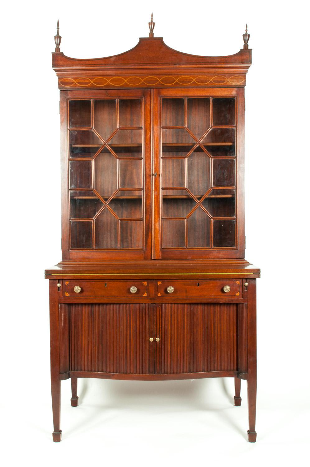 Charak hand-carved two-piece mahogany display cabinet with intricate design details. The piece is in great vintage condition, this cabinet was made in 1931 and it's numbered 6. Minor wear consistent with age / use .The cabinet measure about 76