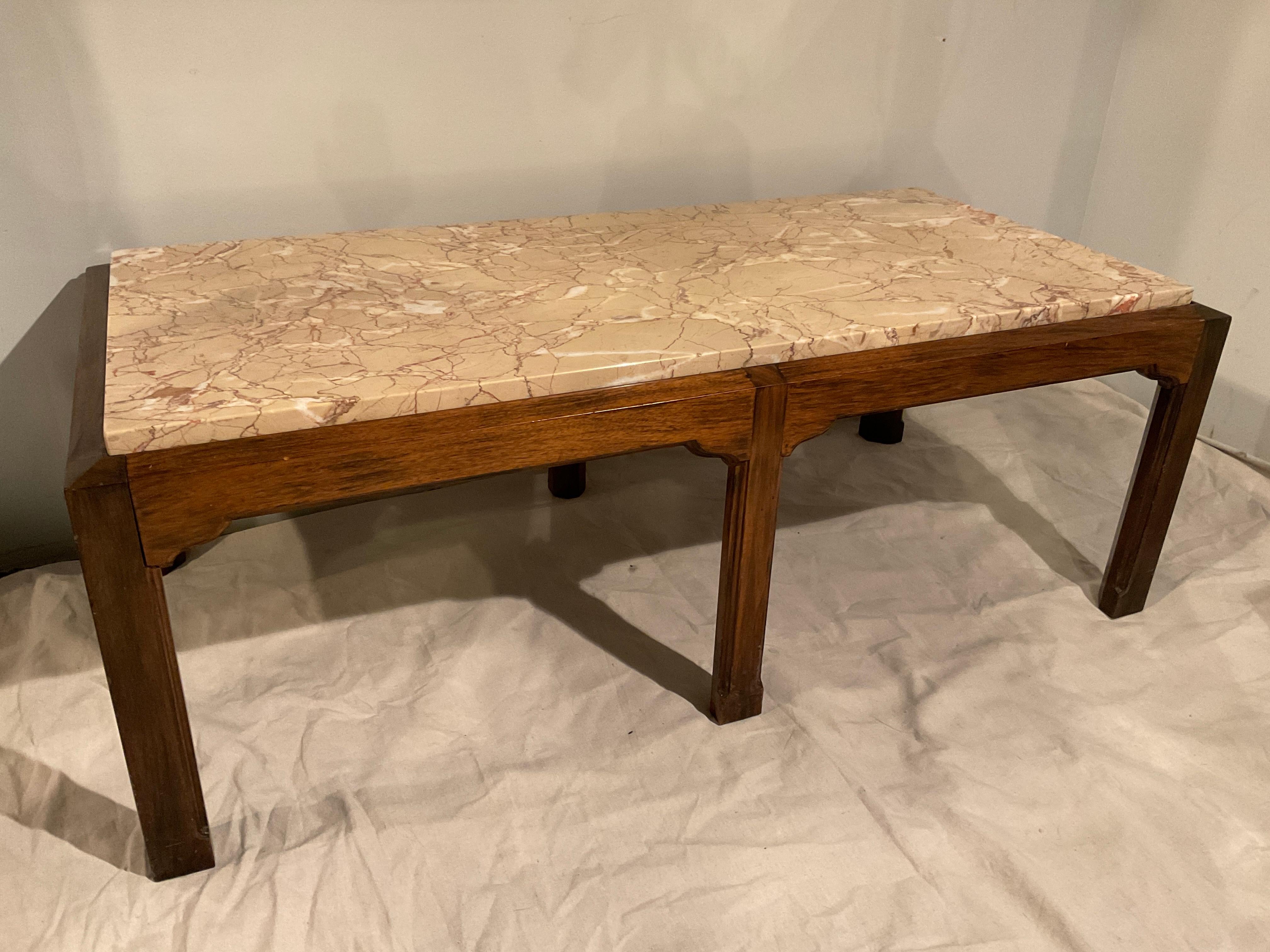 Marble top coffee table on wood base by Charak made in 1952.