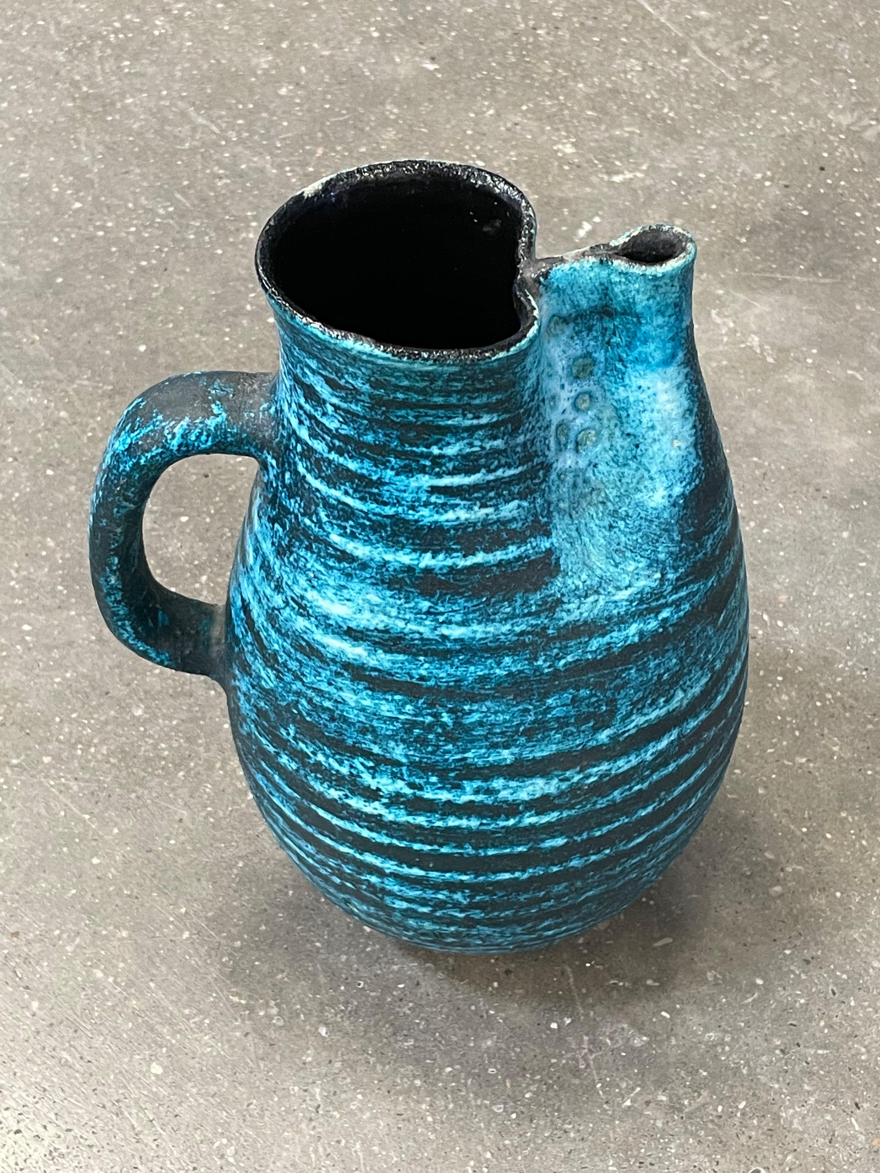 Mid Century French horizontal stripe deep turquoise and charcoal vase by Accolay.
Accolay pottery was hand made in Accolay, France from 1945 to 1989. 
From a collection of four pieces (S6180/2/3 )
