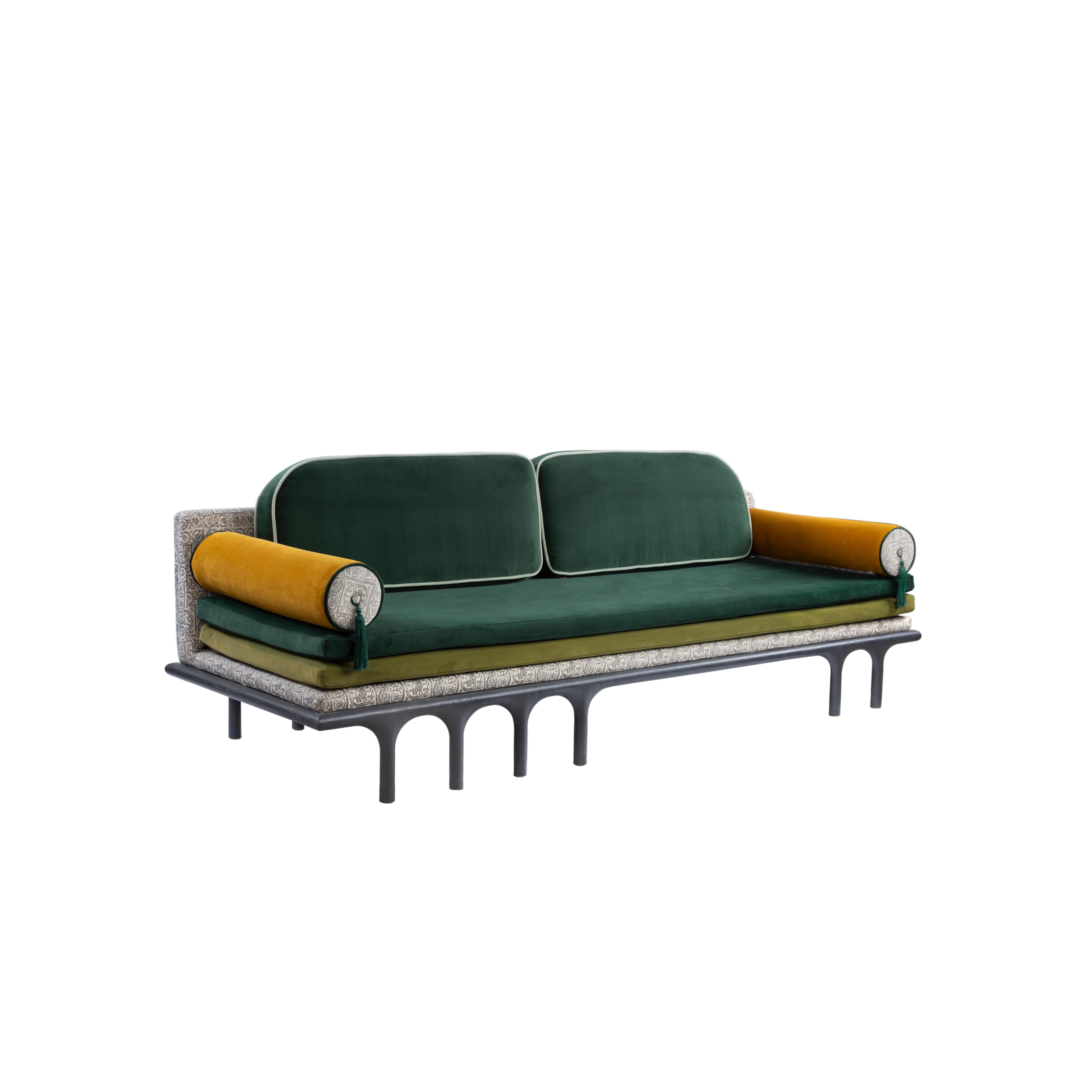 Charcoal Black Hand-Carved Massive Oak Wood Sofa with Velvet Green Upholstery.
Inspired by the legendary Hassan Fathy, this sofa pays homage to his architectural philosophies and principles, from arches for ventilation, to a simpler lifestyle and