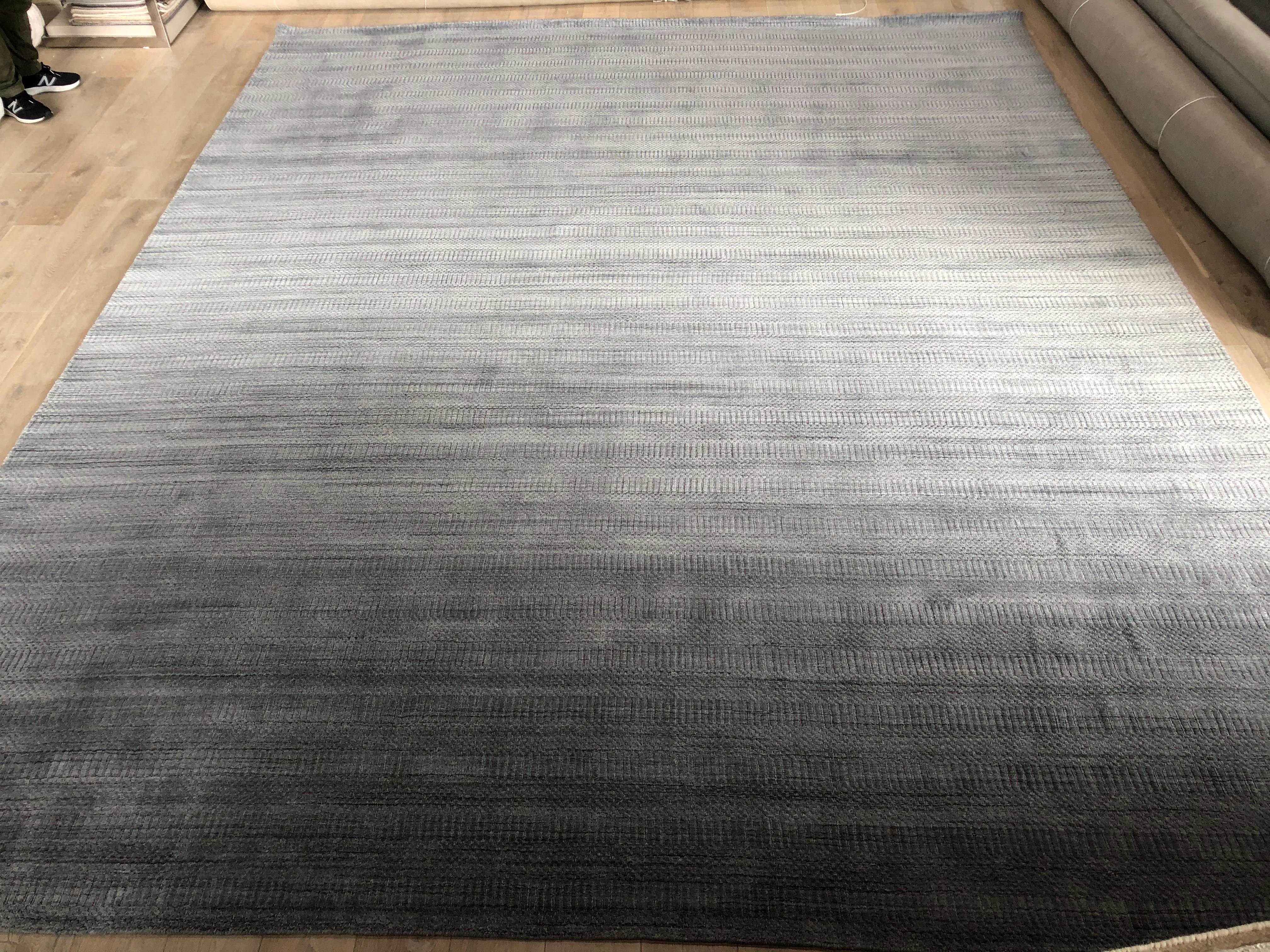 Charcoal dark gray ombre rug.