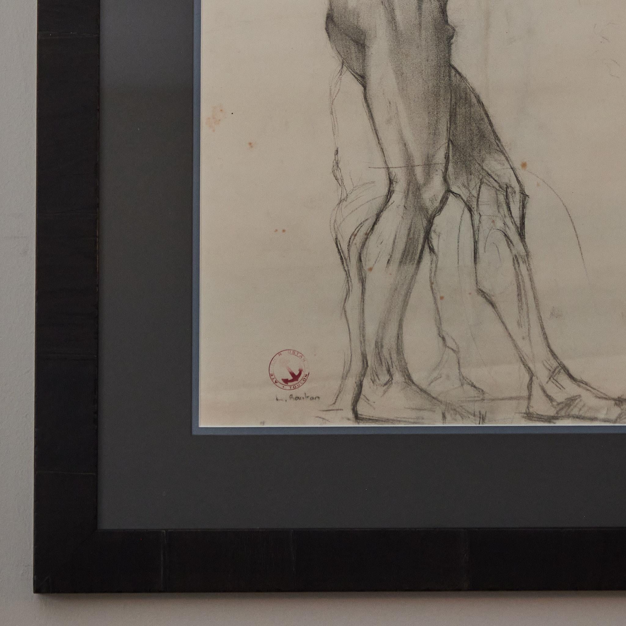 Early 20th-century charcoal drawing of standing nude male model in the classical tradition of the French Academy. Mounted in a custom wood frame, the image has a pensive quality, and a beautiful treatment of line and contour.

France, circa
