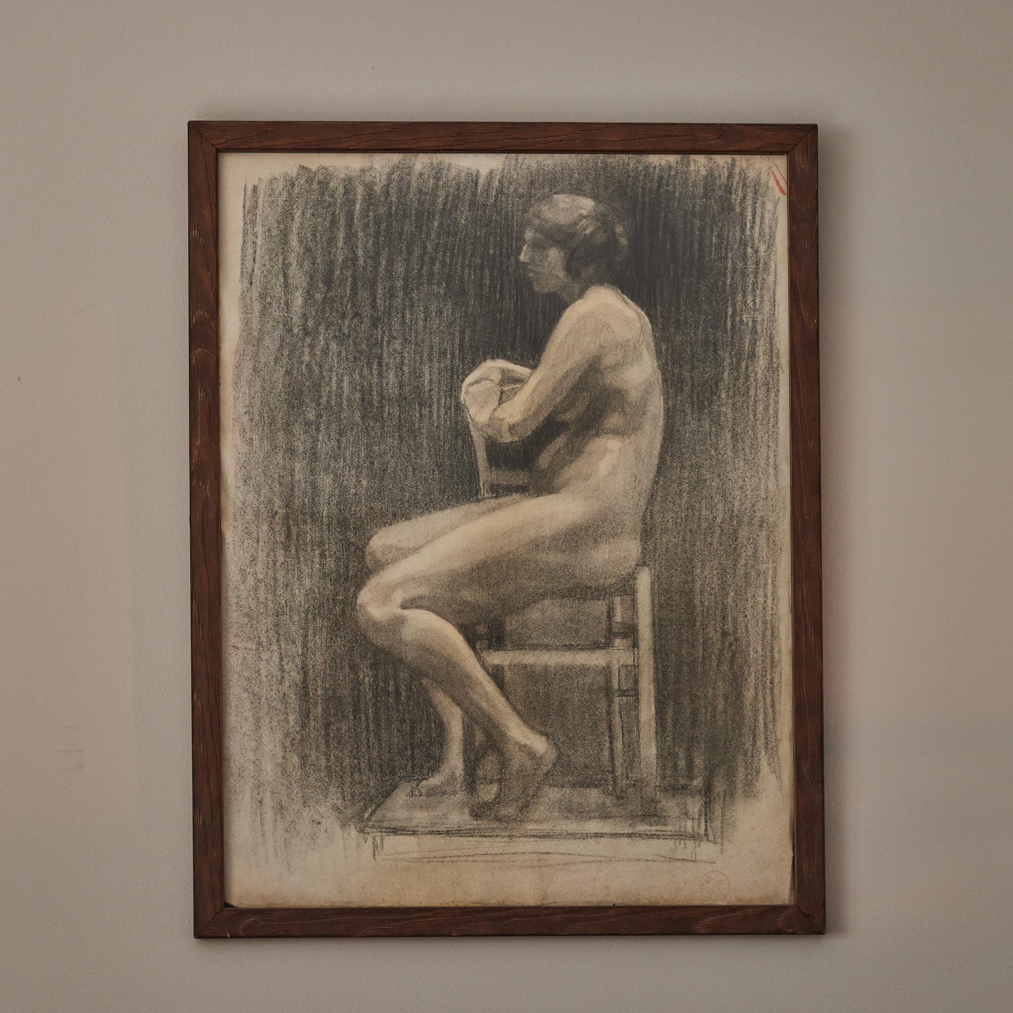 Early 20th-century French Academy-style charcoal drawing of seated nude female model. Mounted in a custom wood frame, the image has a pensive quality, and a beautiful treatment of light and shadow.