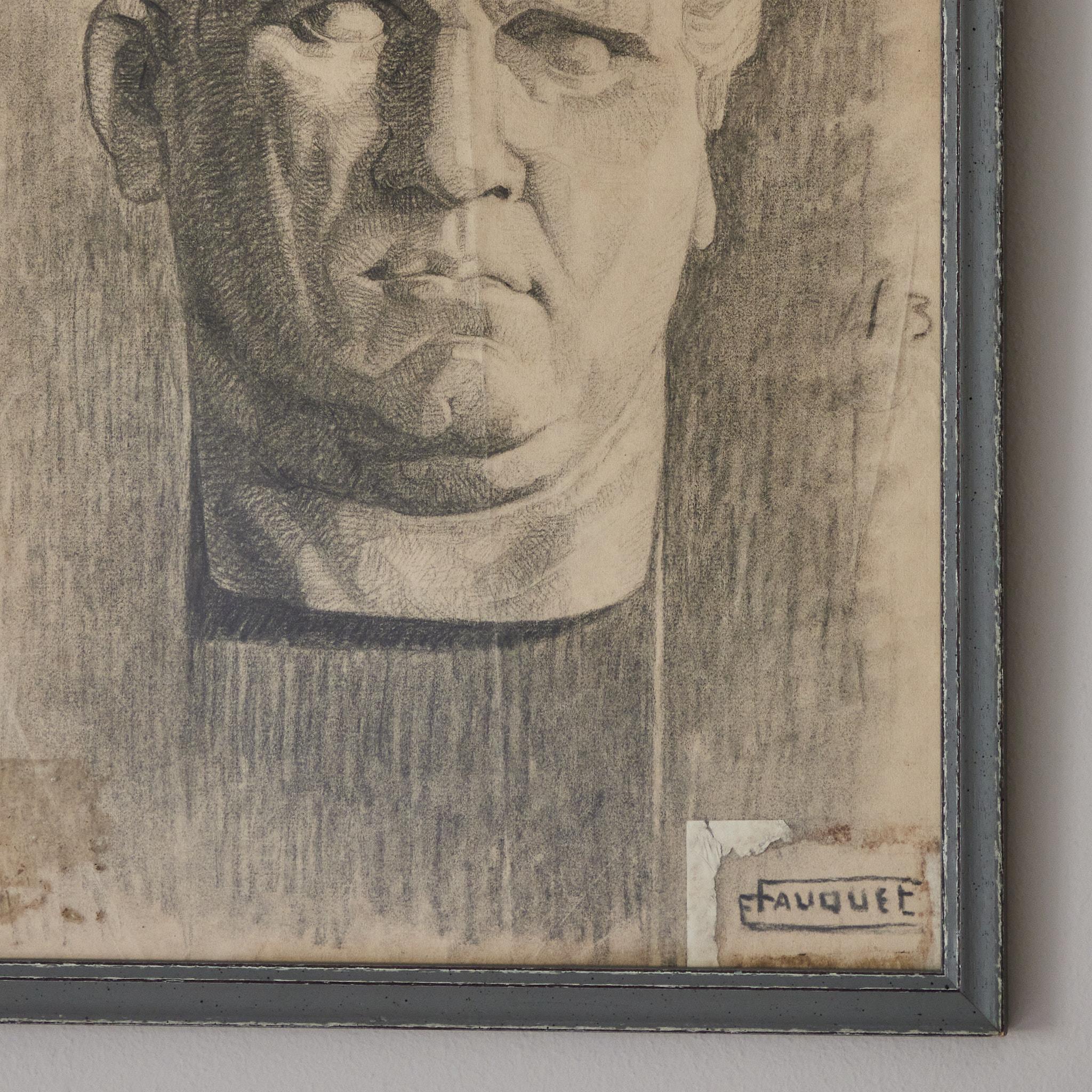 Signed charcoal pencil drawing of a Roman bust from late 19th-century France, mounted in a thin gray painted wooden frame. With its academic classicism and impeccable attention to detail, the piece is compelling for the way it depicts both art and