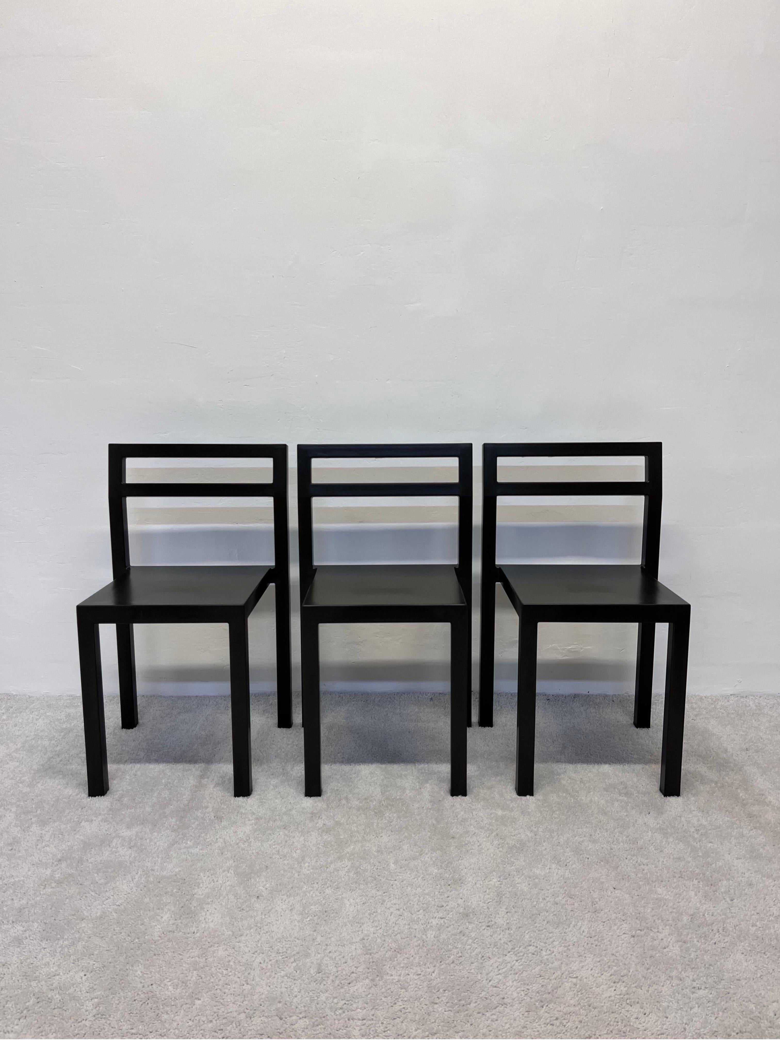 Three NON chairs in charcoal gray PUR-Rubber over a steel frame designed by Boris Berlin and Poul Christensen for Kallemo AB Sweden.

NON is a monoblock chair moulded in PUR-rubber in one shot. Geometrically straight yet comfortable, thanks to the