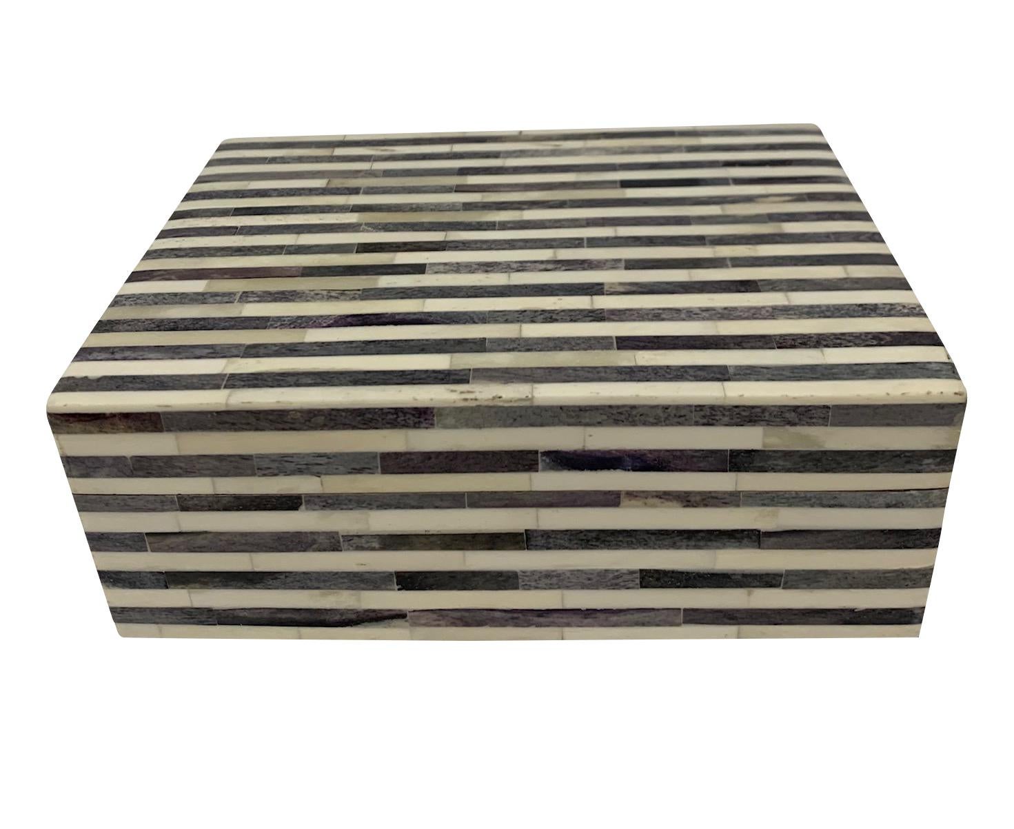 Contemporary Indian lidded bone decorative box. 
Horizontal charcoal grey and cream stripes.
Part of a large collection of bone boxes.