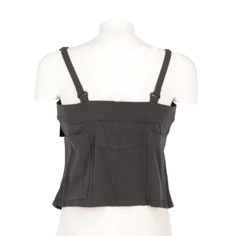 Charcoal grey Marithé + François Girbaud 2000s crop top. Straight neckline, adjustable straps with buckles. Front buttoning and two side pockets spreaded on the back.

Size: 42 IT

Flat measurements
Height: 49 cm
Bust: 42 cm

Product code:

Notes: