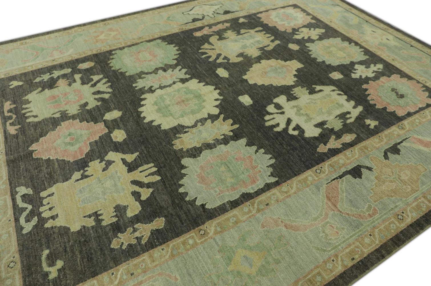 This modern Turkish Oushak rug is a stunning piece of art that has been handwoven using traditional techniques by skilled artisans. The rug features intricate patterns and a soft color palette that is achieved through the use of natural vegetable