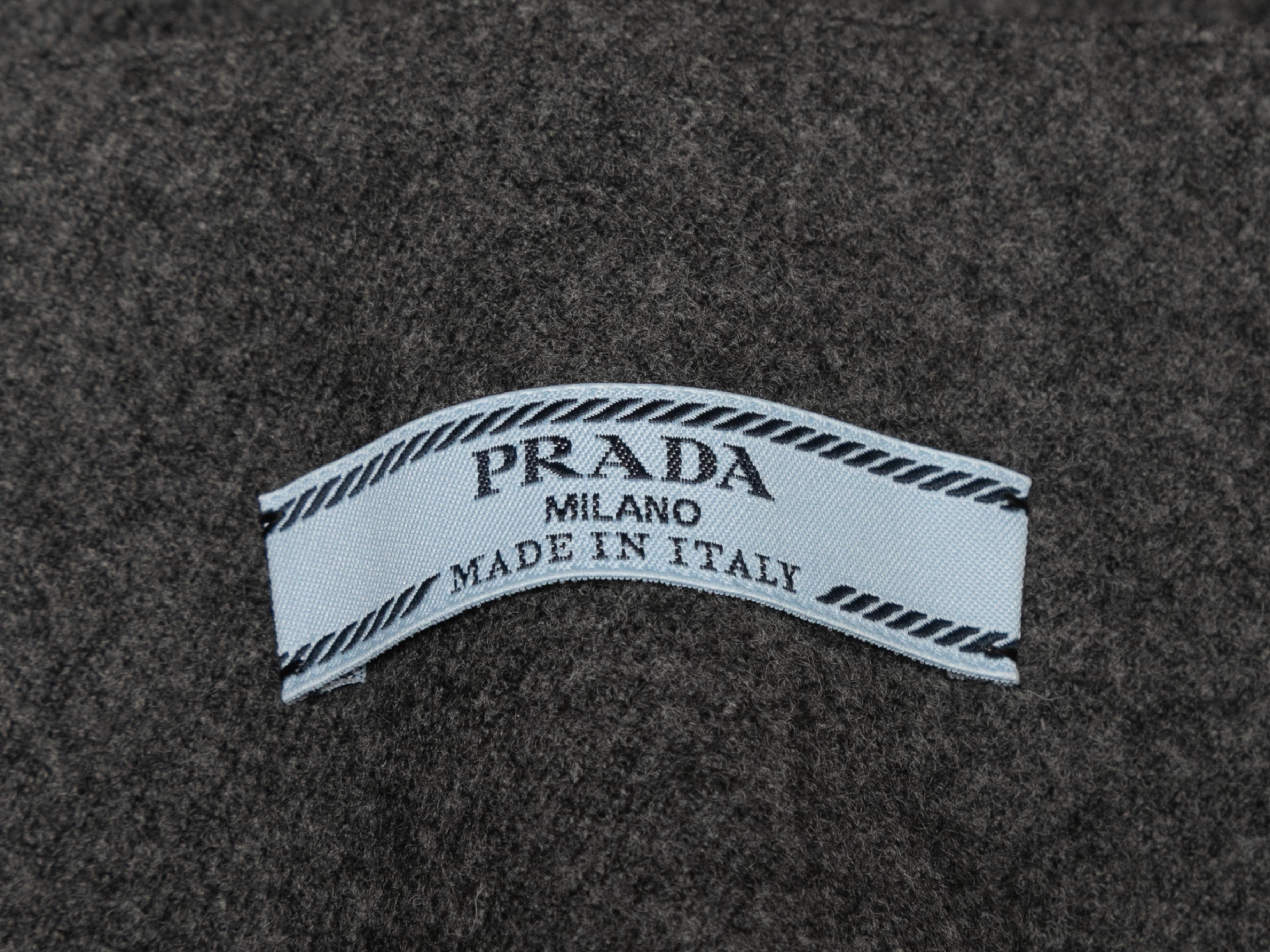 Charcoal virgin wool straight-leg pants by Prada. Circa 2018. Belt at waist. Side zip closure. 33