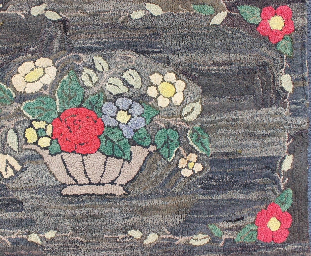 Charcoal, red, and green antique American Hooked rug with large flower design, Keivan Woven Arts / rug S12-0807, country of origin / type: United States / Hooked, circa 1900

This colorful vintage American Hooked rug depicts a variety of vines and