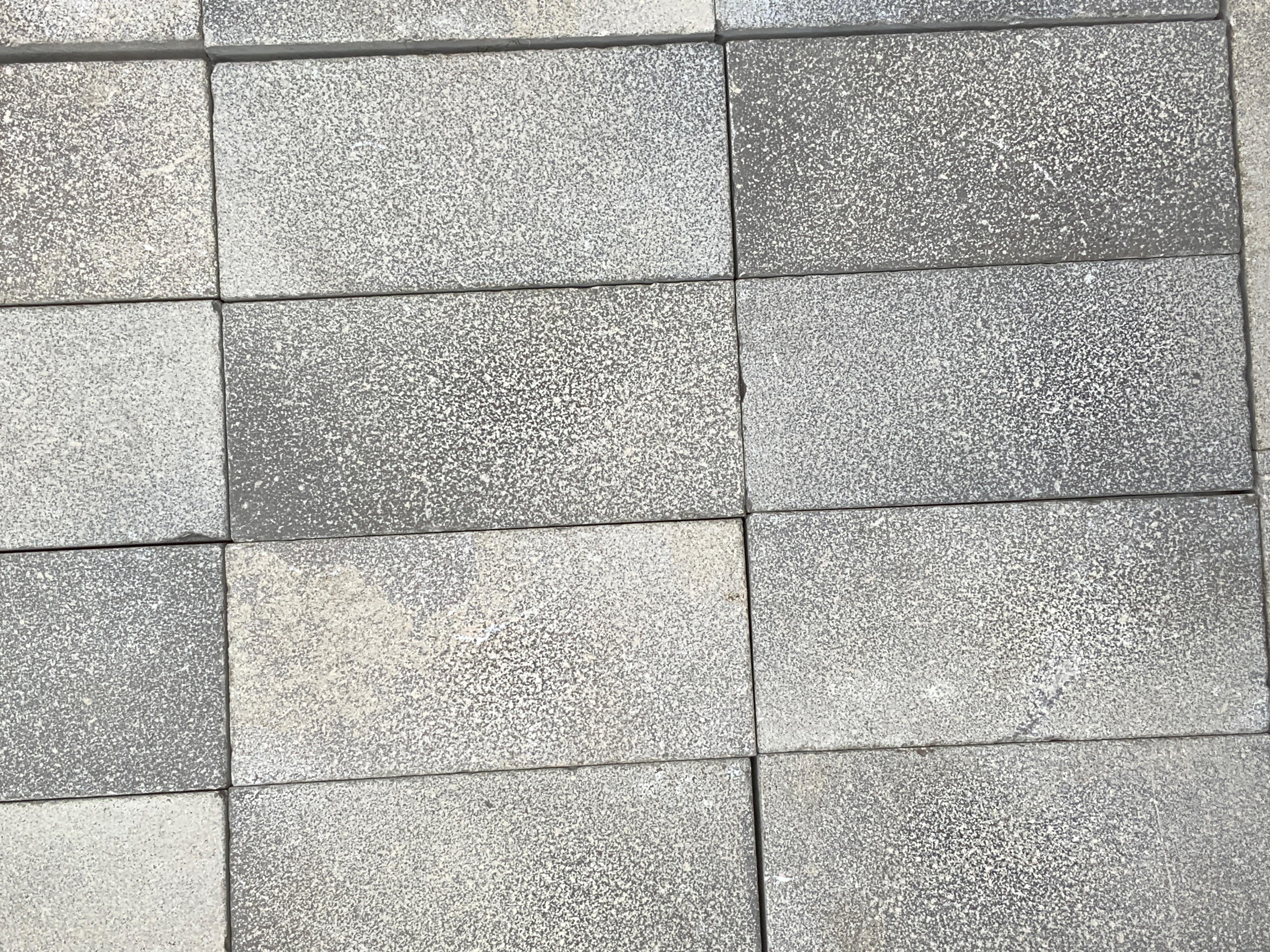 Lovely charcoal tiles imported from Europe. Measures 8.6 x 2.3 in.