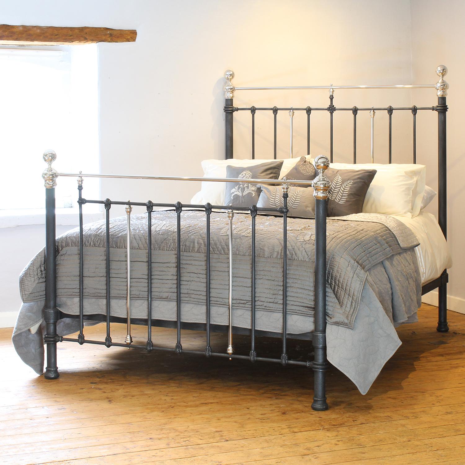 A handsome cast iron Victorian antique bed finished in charcoal with nickel plated rails, knobs and collars, and decorative castings.

This bed accepts a UK king size or US queen size (5ft, 60in or 150cm wide) base and mattress set.

The price
